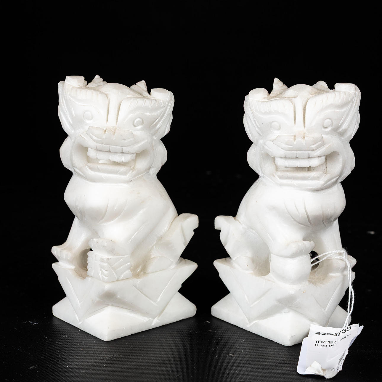 TEMPLE DOGS, a pair.