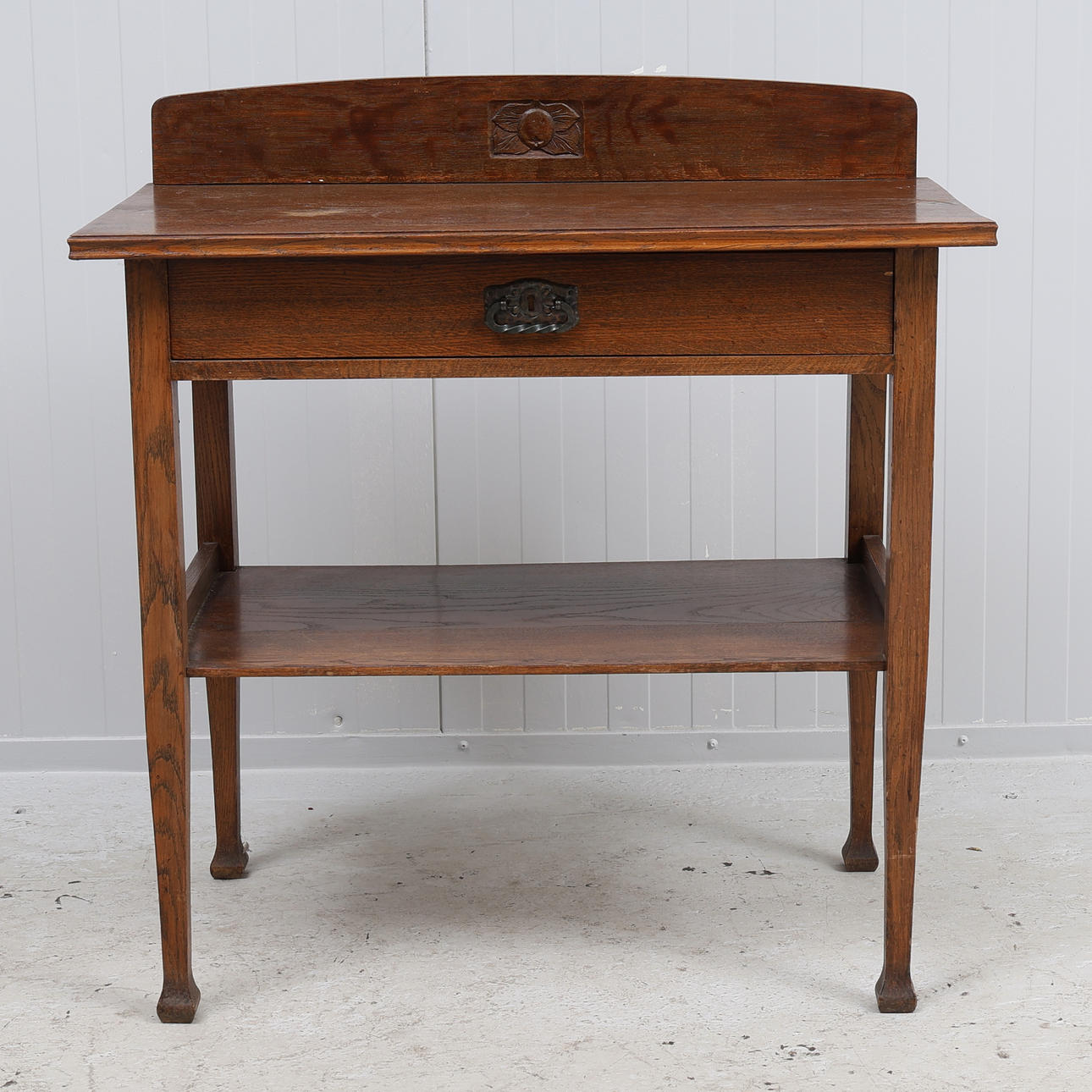 An Art Nouveau oak serving table, first half of the 20th century.