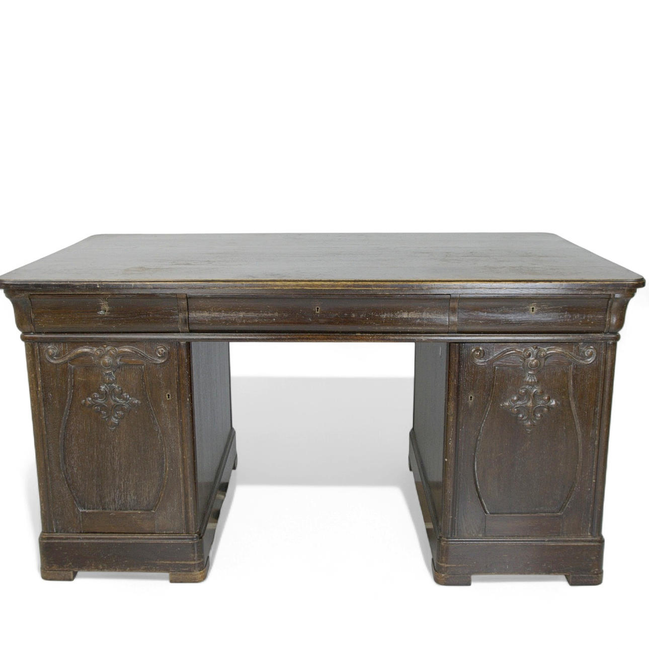 A 20th-century split oak desk.