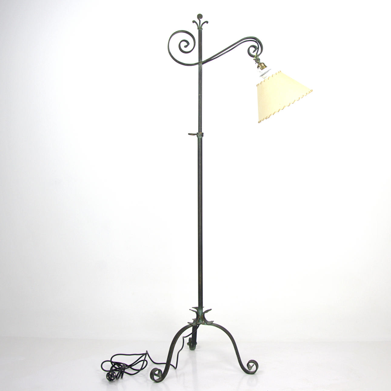 A wrought floor lamp, a light spot, adjustable height and light source, 20th century.