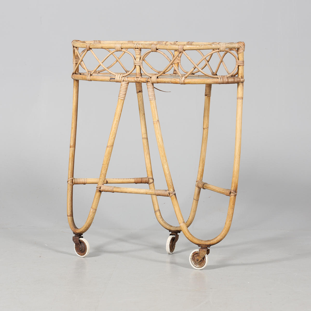 FLOWER TABLE on wheels, rattan and glass.