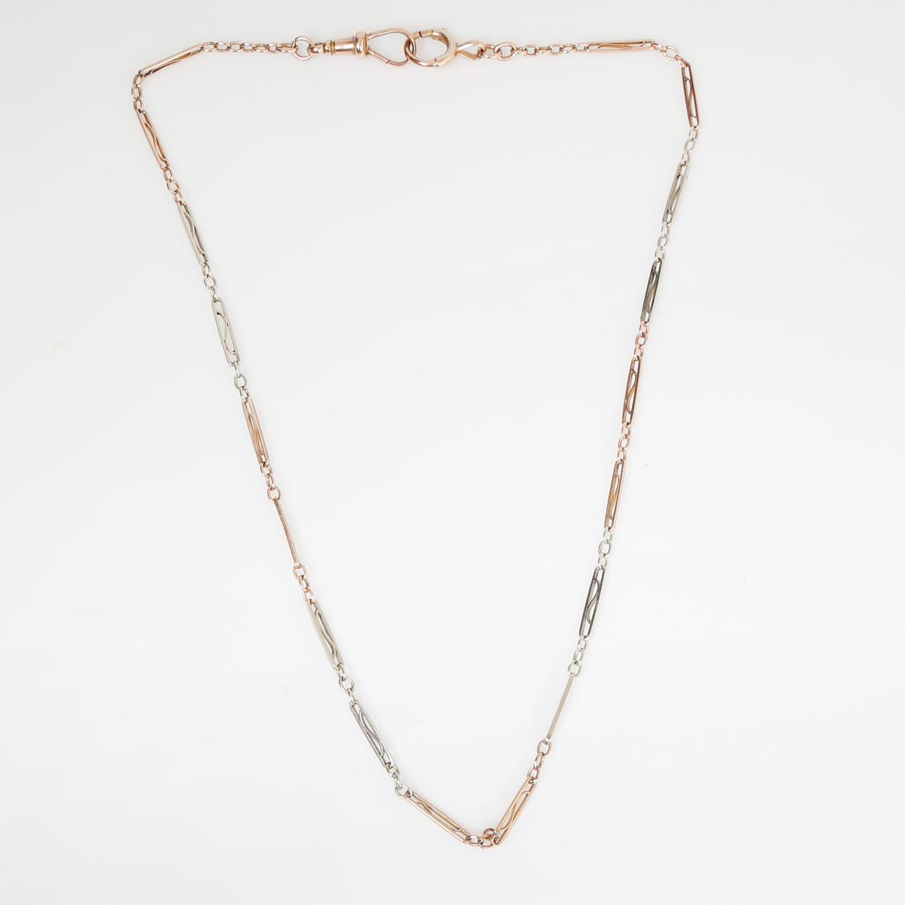 A 9 CARAT GOLD POCKET WATCH CHAIN.