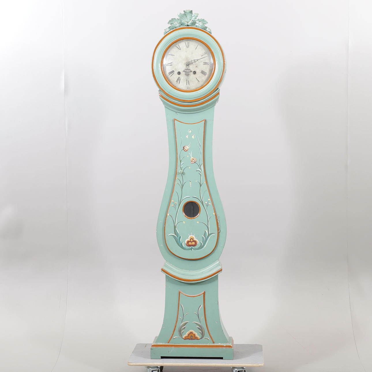 A painted floor clock, 19th century.
