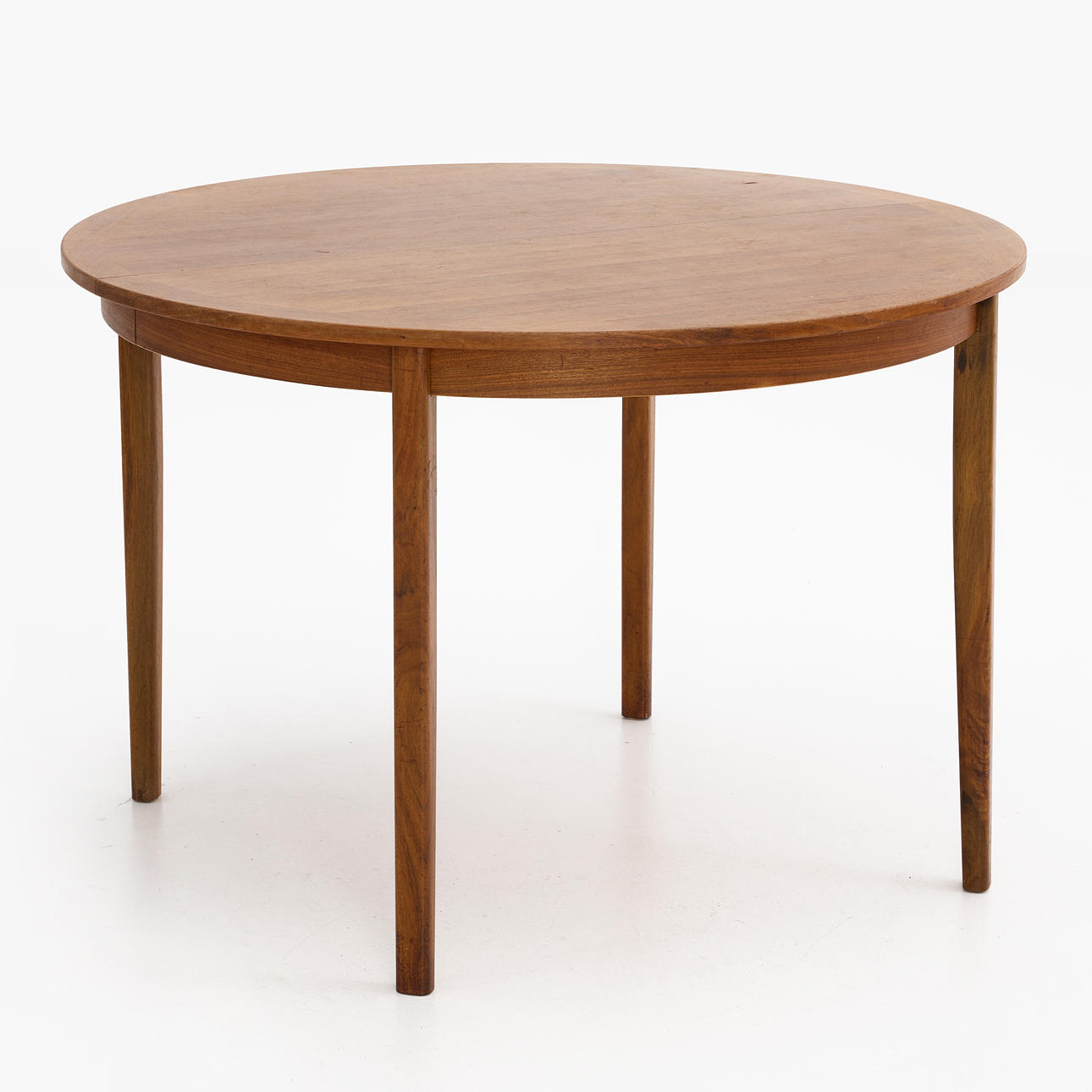 A teak veneered dining table, second half of the 20th century, with insert top.