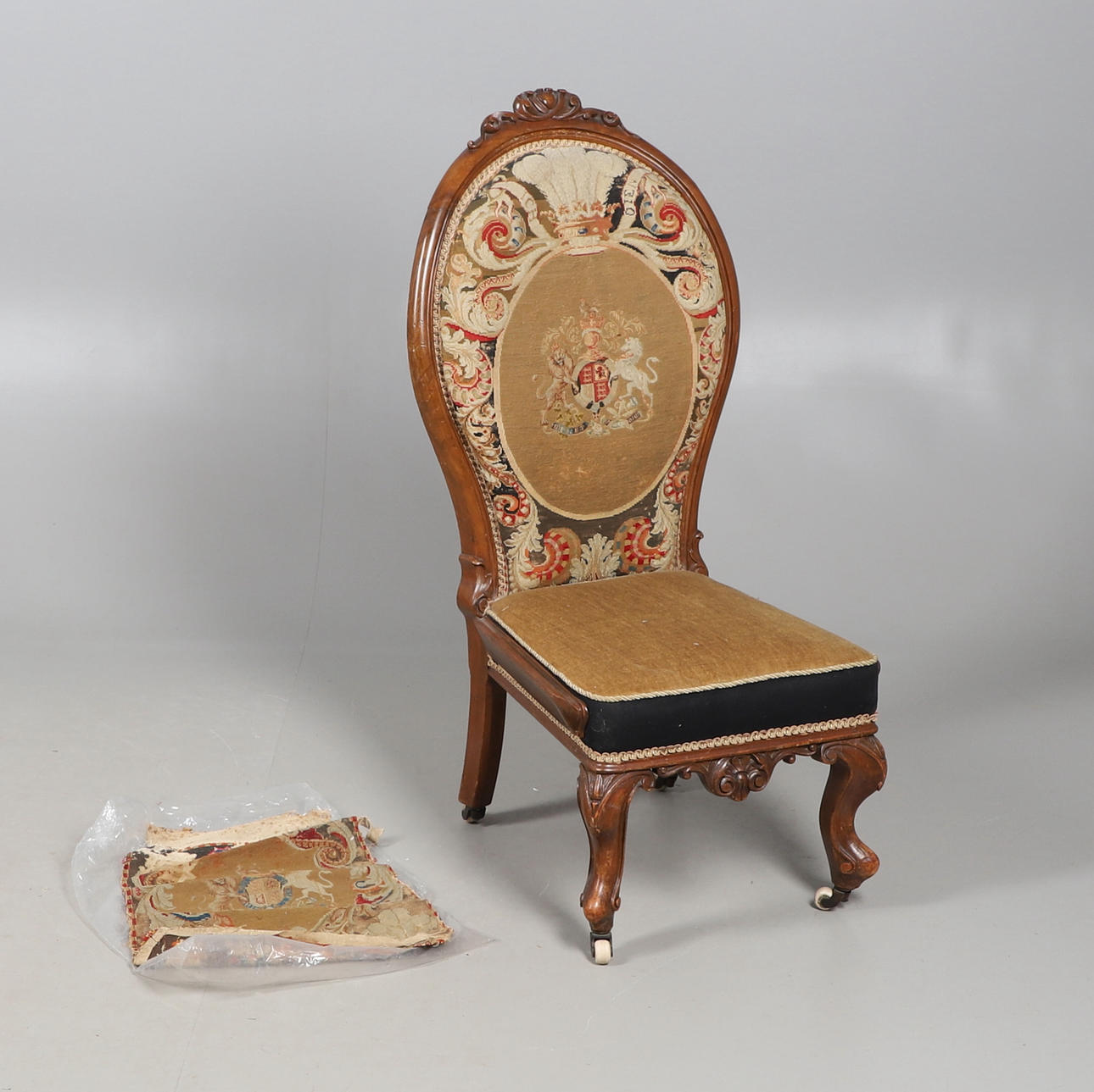 A VICTORIAN NEEDLEWORK UPHOLSTERED CHAIR.