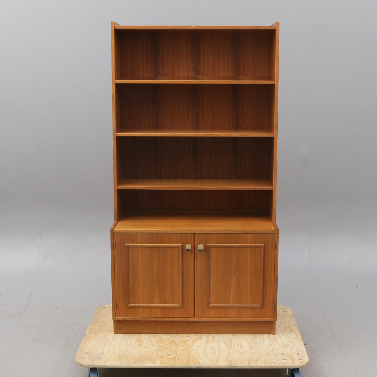 FLOOR BOOKCASE, with cabinet base.