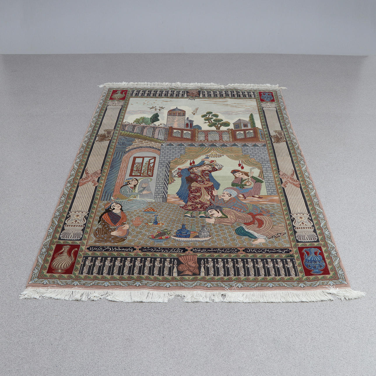 FIGURAL CARPET. Handknotted. Wool on cotton wool. Signed and with text elements.