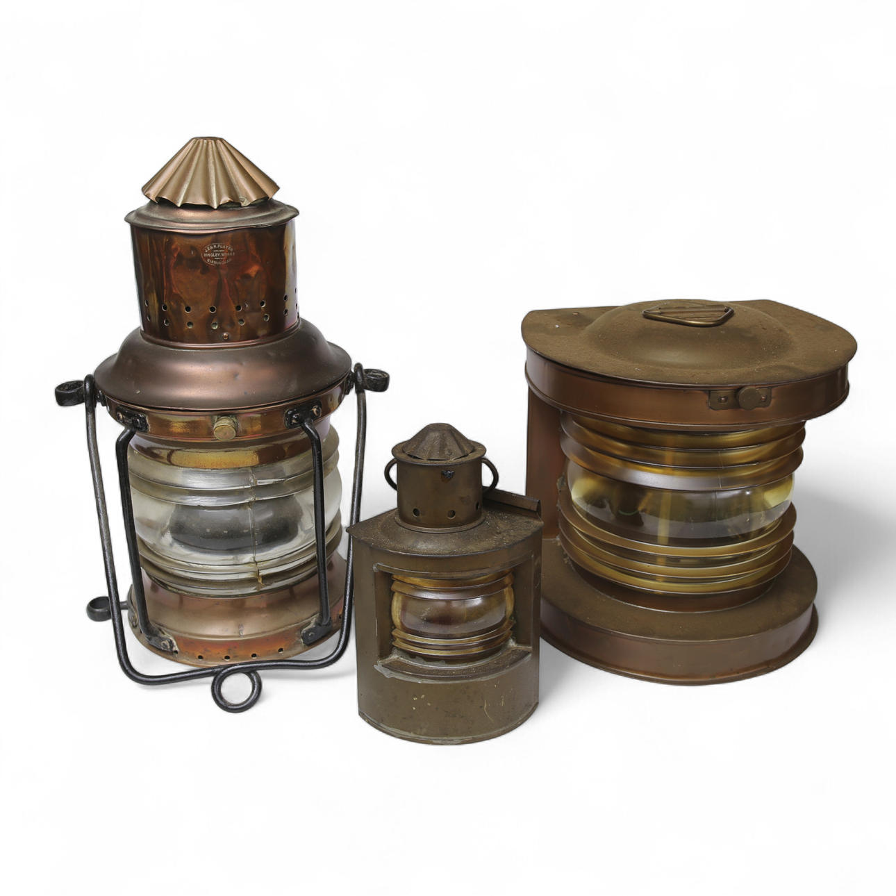 Three early 20th century copper and glass lanterns.