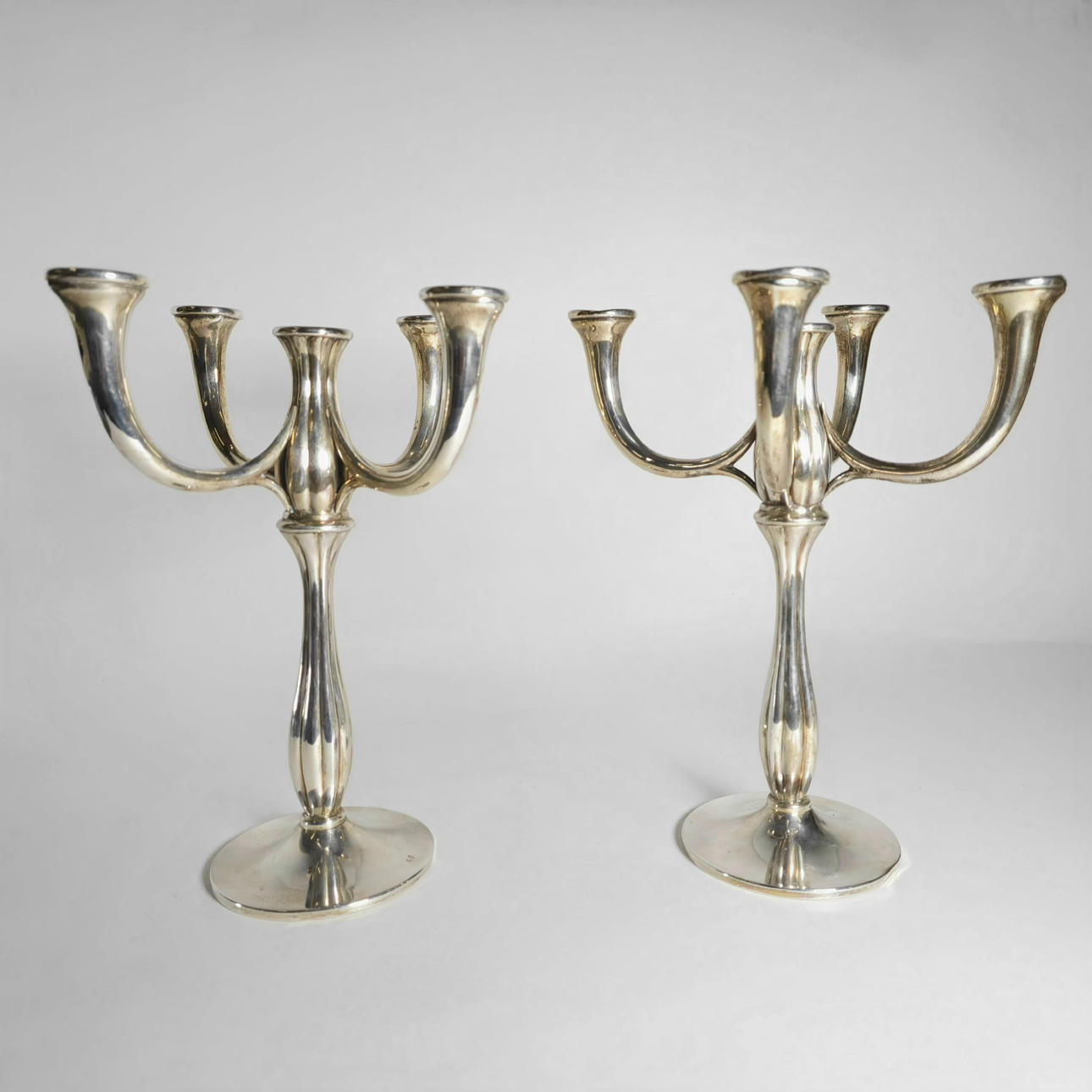 PAIR OF CANDLESTICKS IN PUNCHED SILVER.