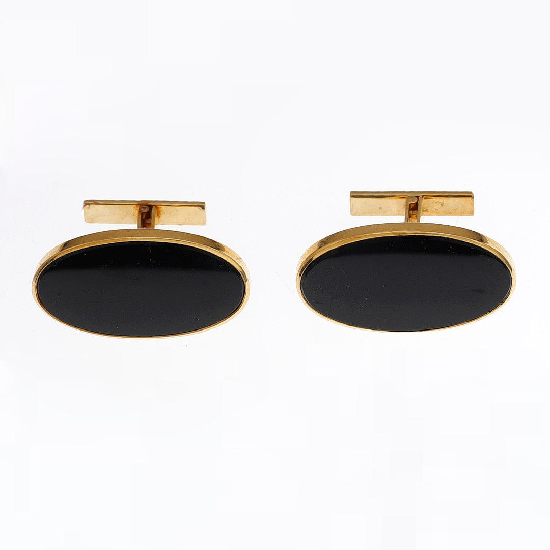 Gold and onyx cufflinks.