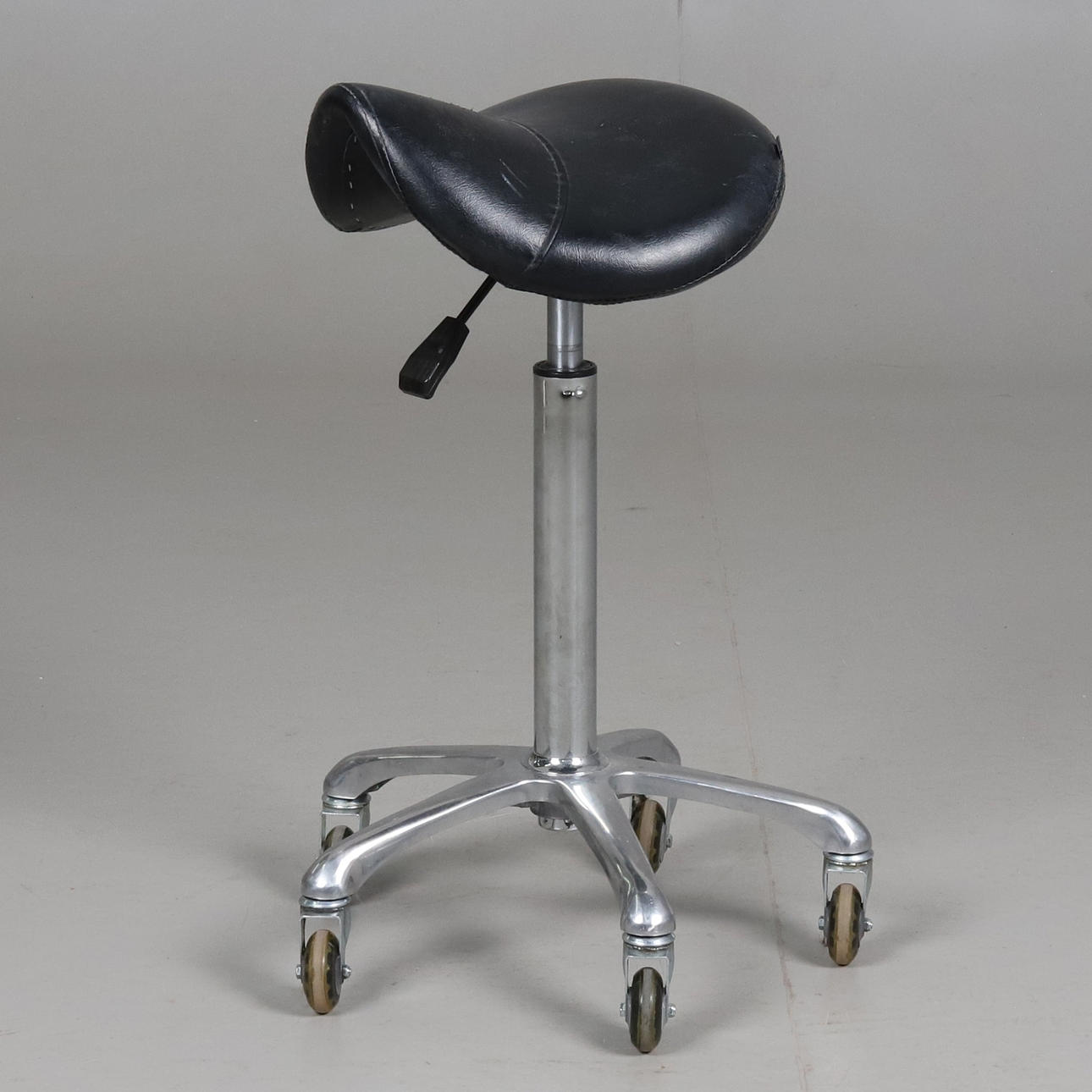 Saddle chair on inline wheels. Adjustable height, Contira.