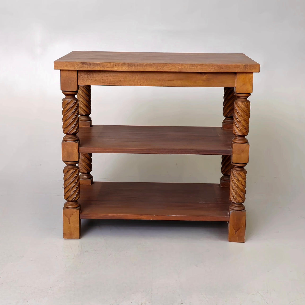 THREE-STORY SIDE TABLE WITH SOLOMONIC COLUMNS.