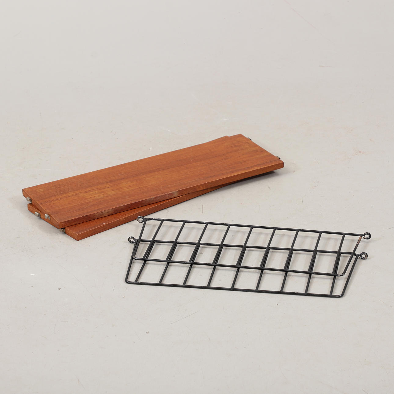 A 1960s teak string shelf.