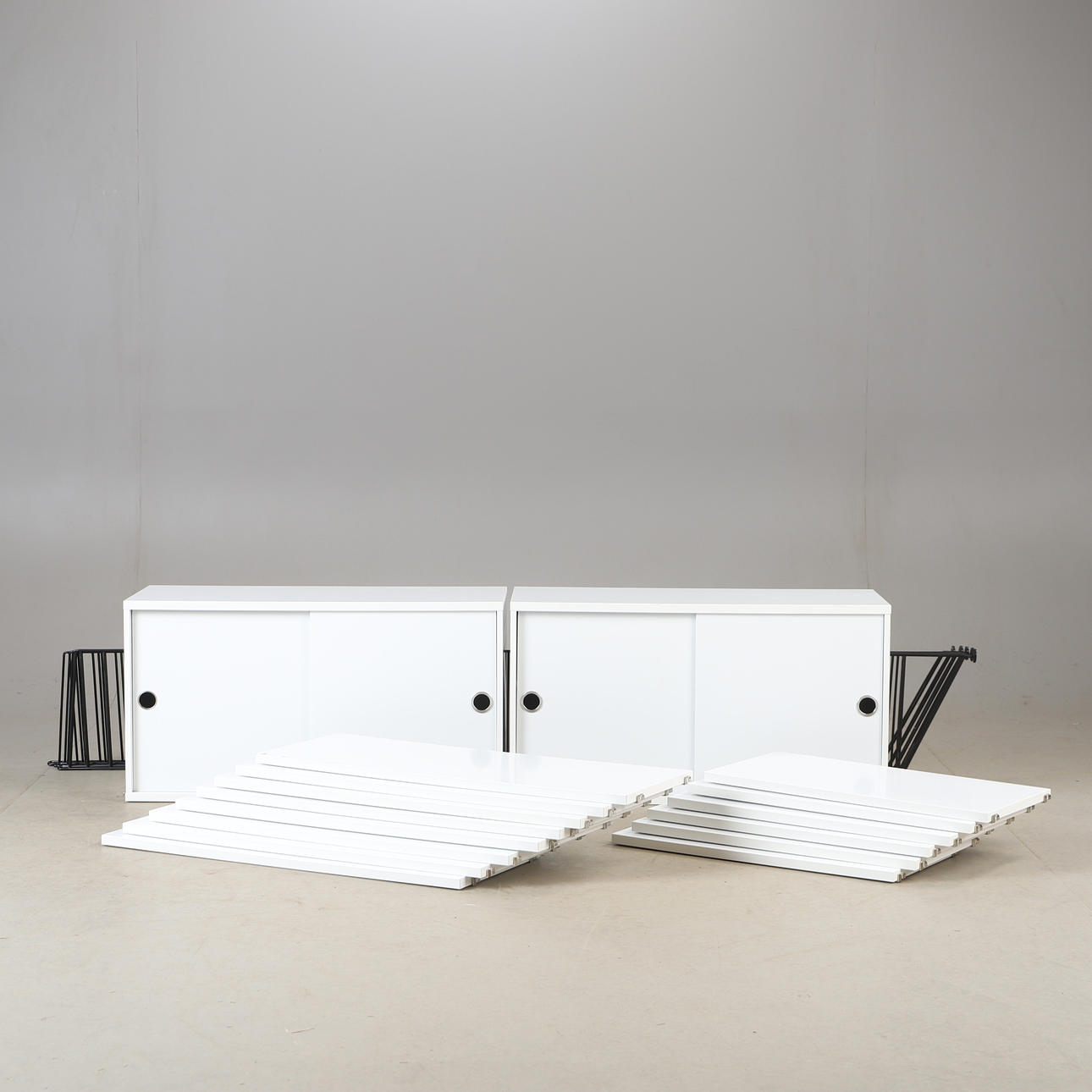 NILS & KAJSA STRINNING. A shelf, white lacquered, String Design, 21st century.