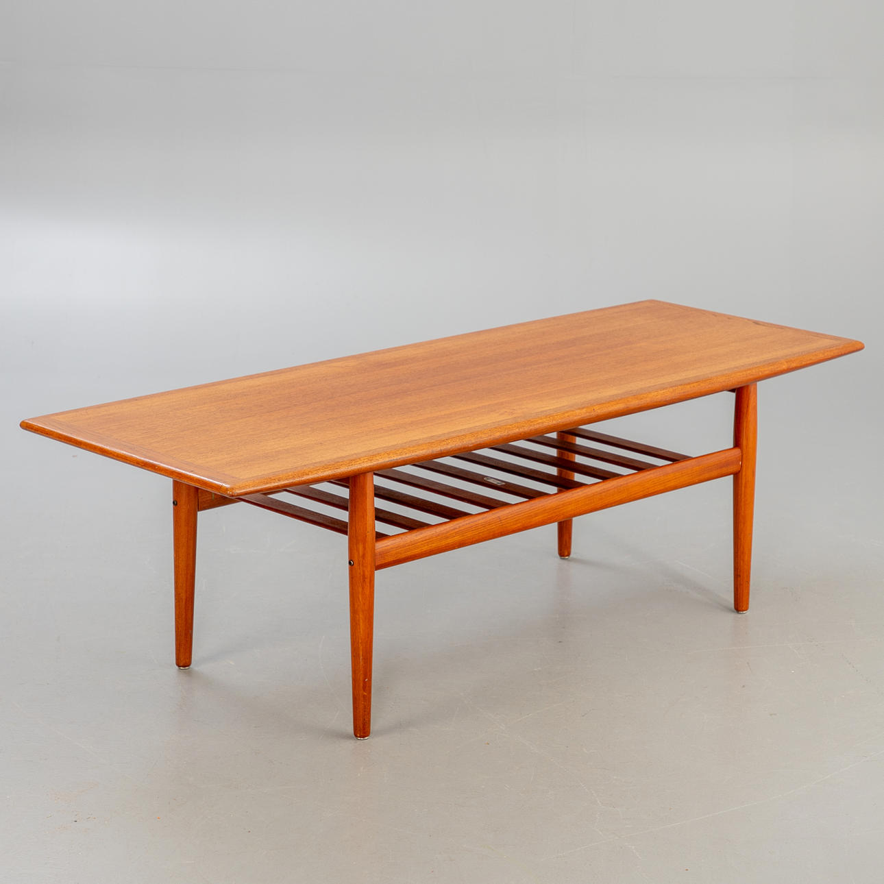 GRETE JALK. Glostrup. Teak coffee table. Denmark, 1960s.