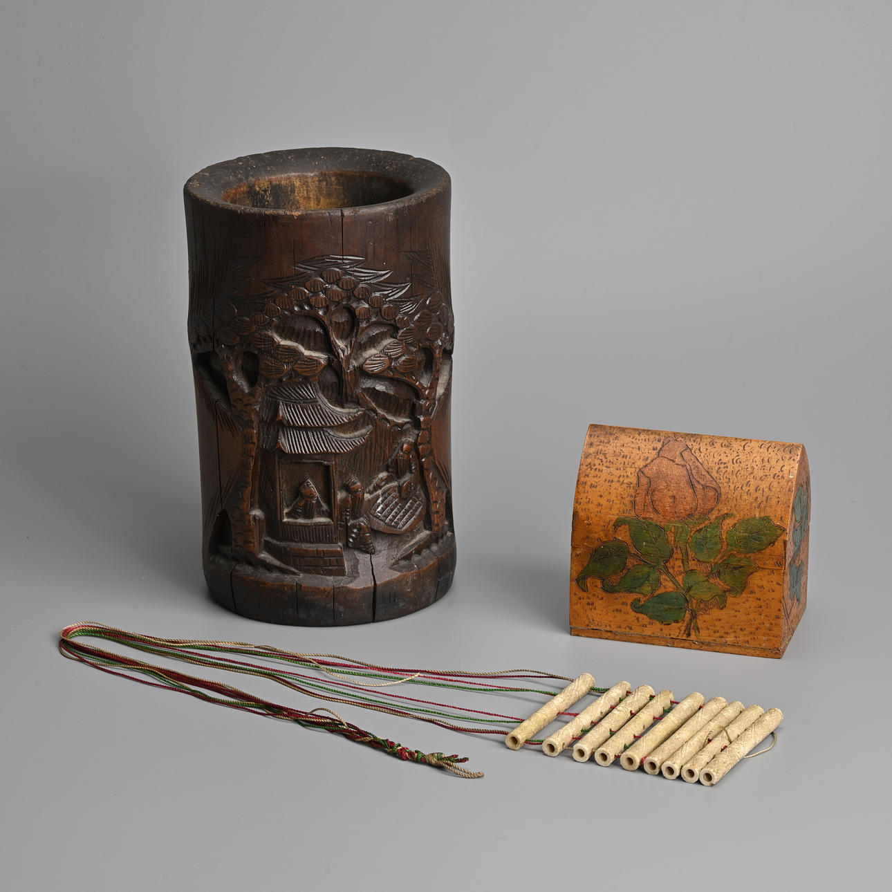 A CHINESE BAMBOO BRUSH POT TOGETHER WITH A STRING AND BONE PUZZLE GAME AND BOX, 20TH CENTURY. (3).