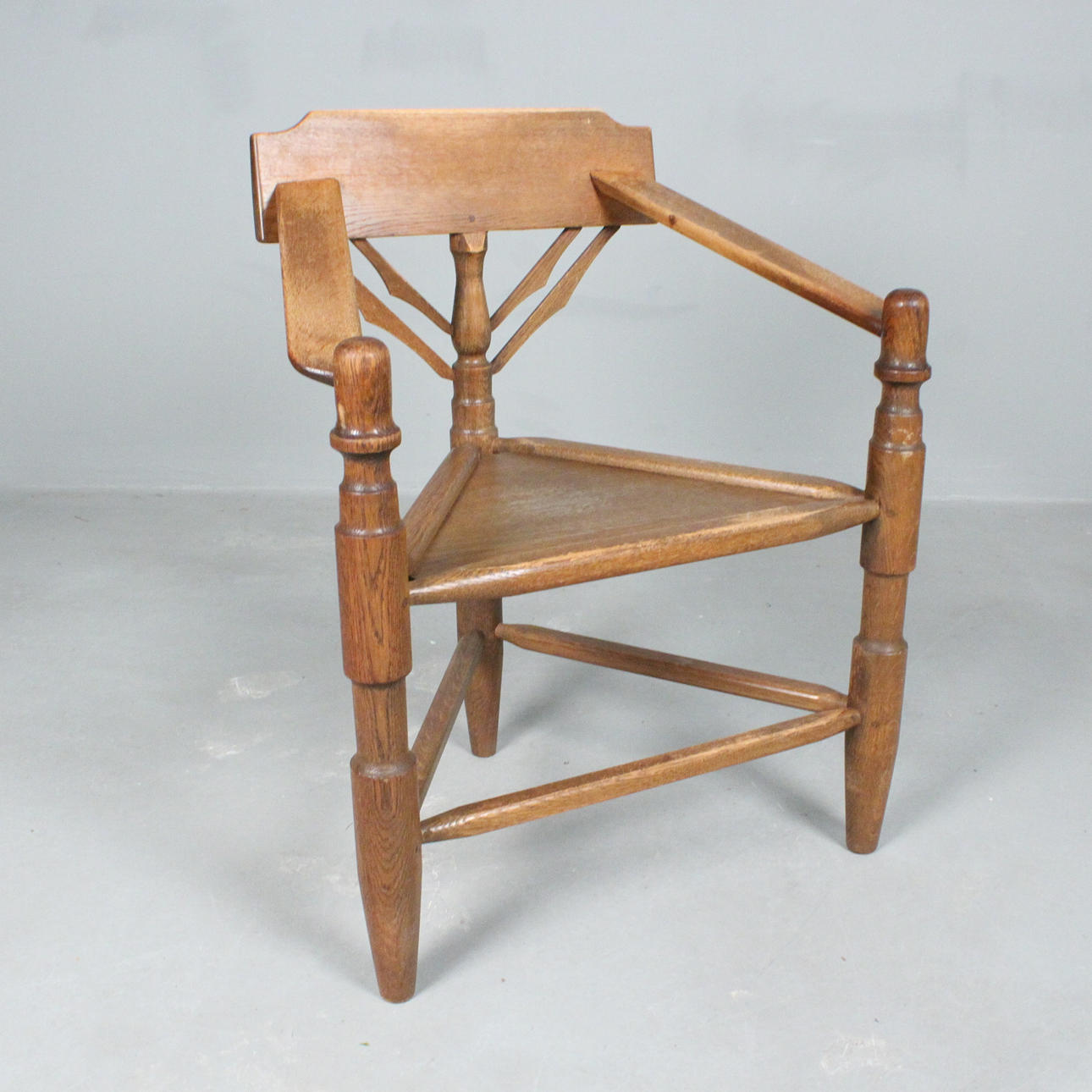 Brutalist carved tripod chair.