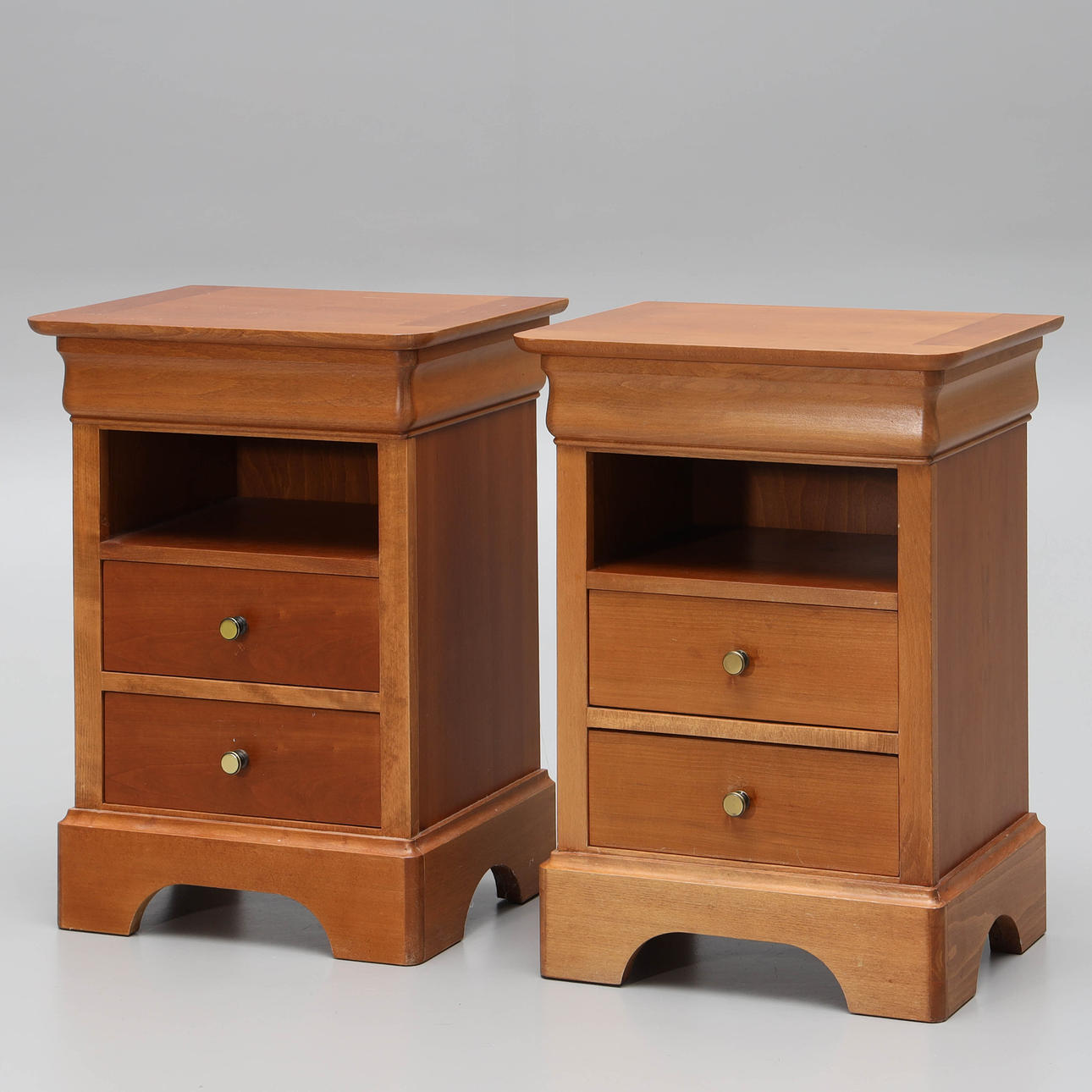 A pair of cherry bedside tables, later part of the 20th century.
