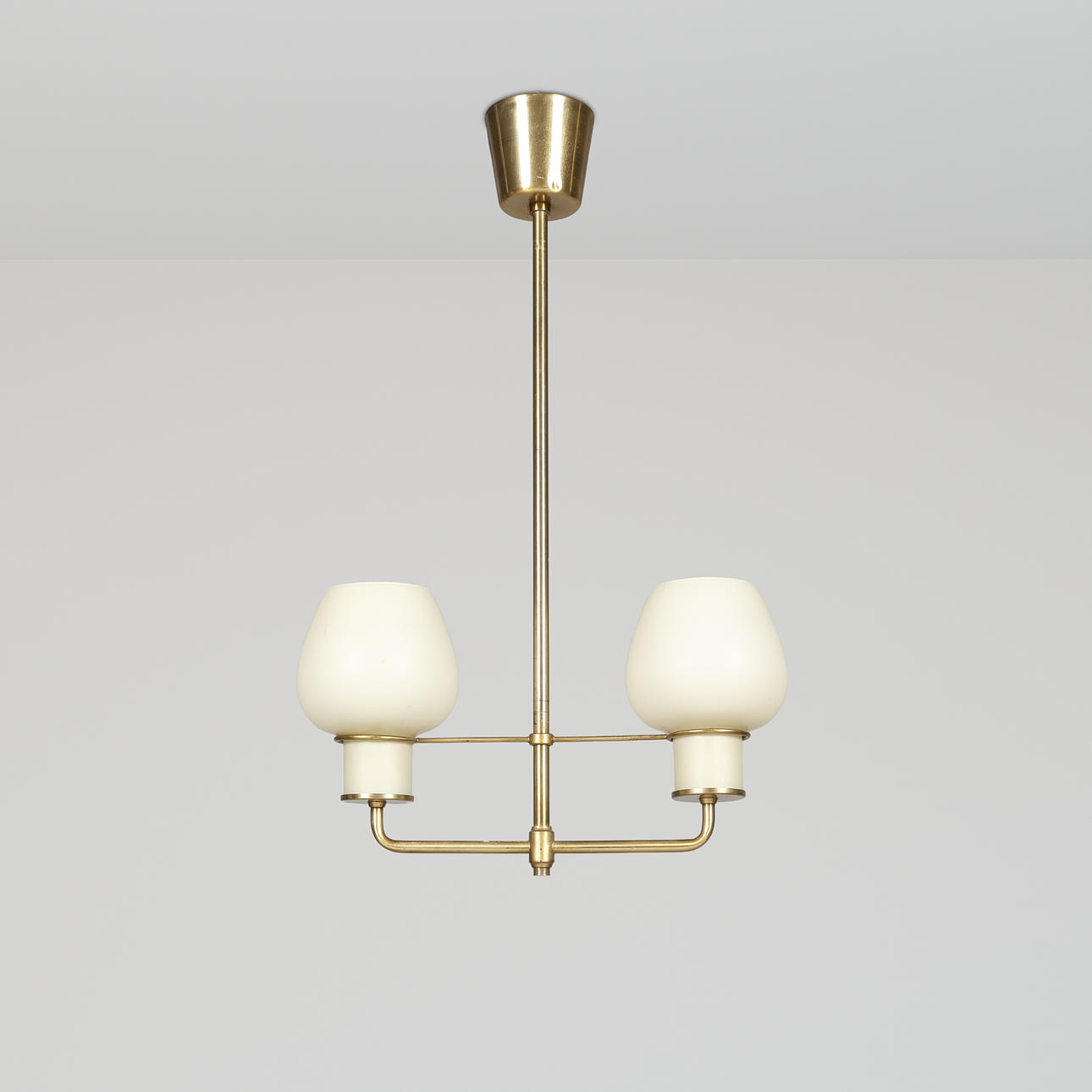 BENT KARLBY. Attributed to. Lyfa ceiling lamp in brass with two domes of opal glass, 1950s.
