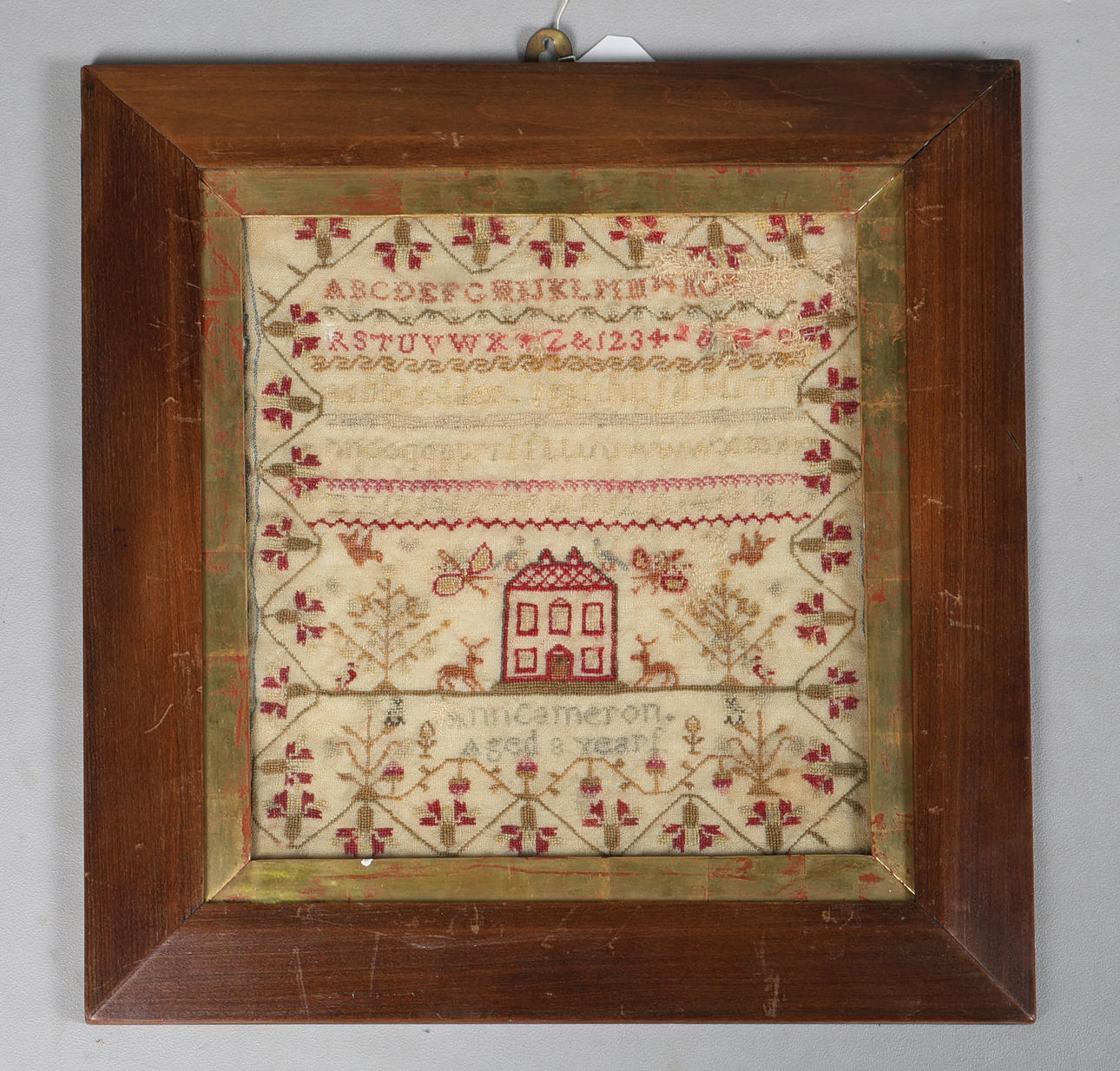 A VICTORIAN NEEDLEWORK SAMPLER.