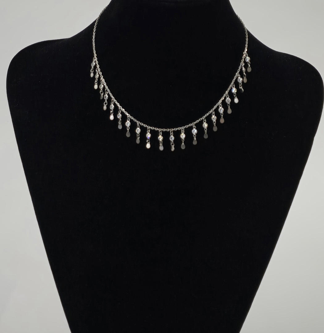 SILVER NECKLACE WITH TEARDROP SHAPED ZIRCONS.