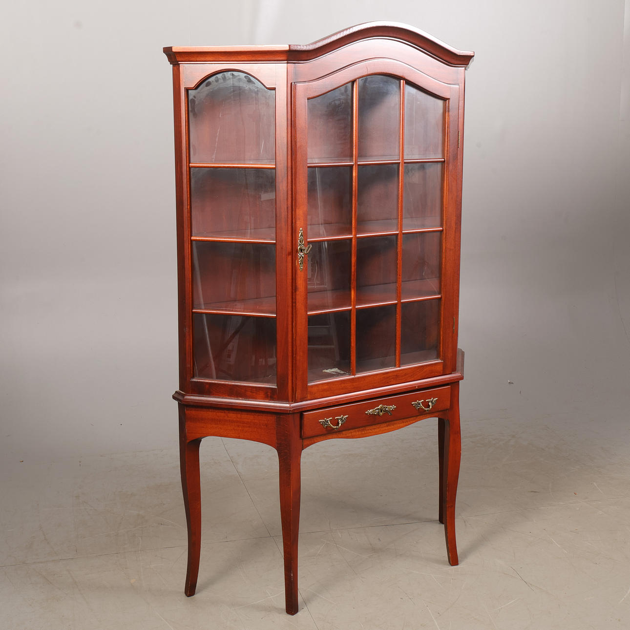 A two-piece display cabinet.