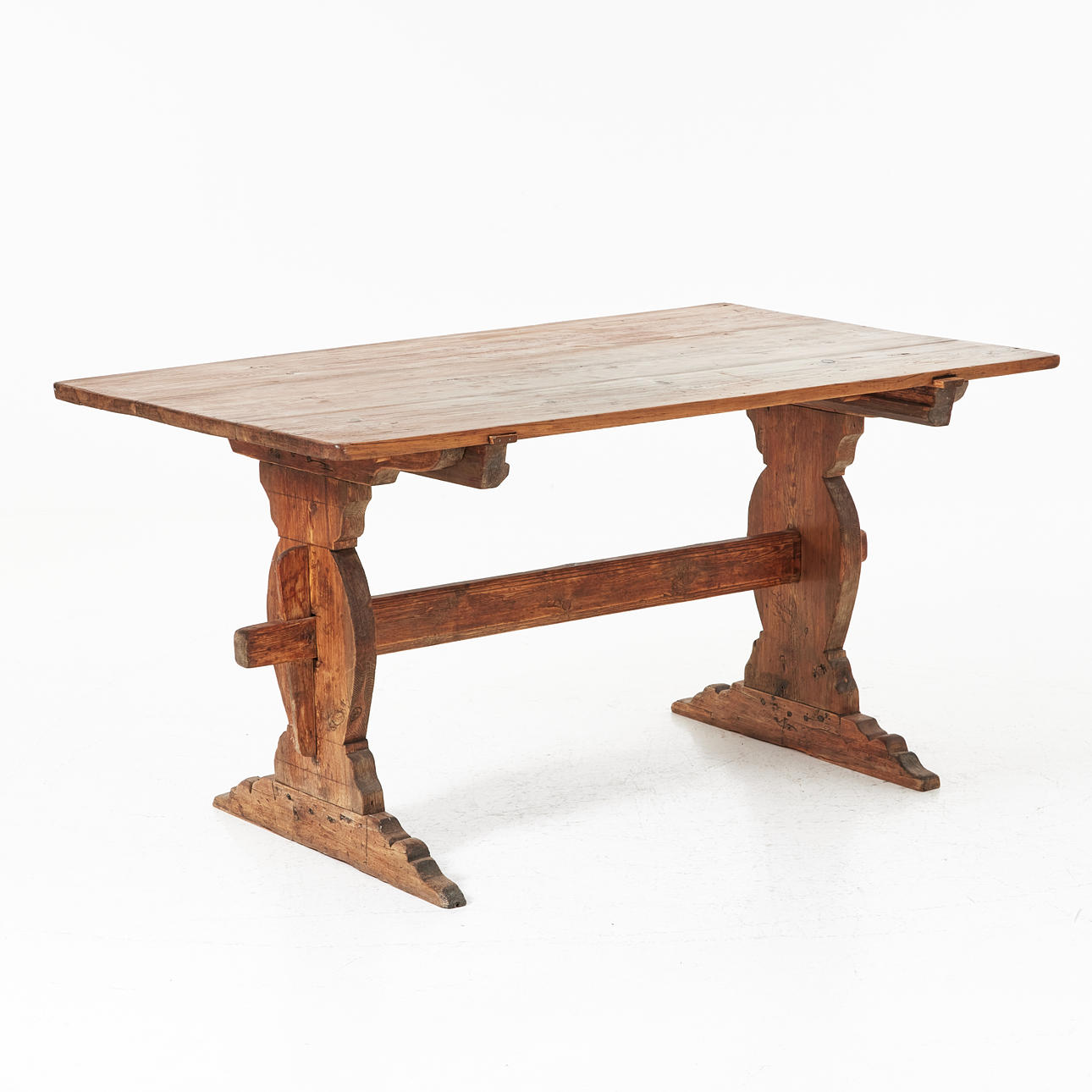 A wooden trestle table, 20th century.