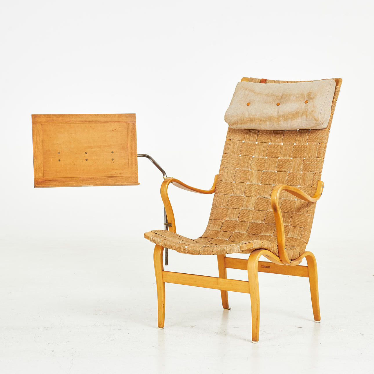 BRUNO MATHSSON. armchair with reading table, frame in book, upholstered in saddle cloth, Firma Karl Mathsson Made in Sweden.