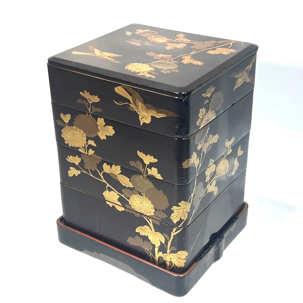 Japanese box with lacquered compartments with flower and bird motifs.