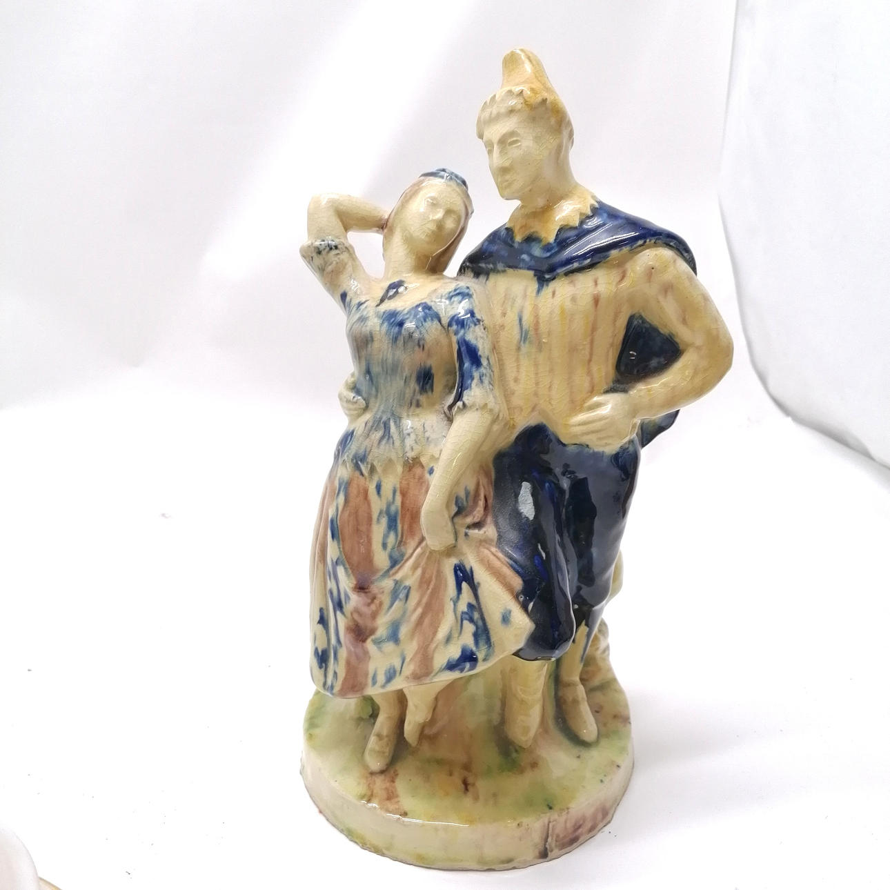 FIGURAL GROUP IN POST MEDIEVAL POTTERY GLAZE.