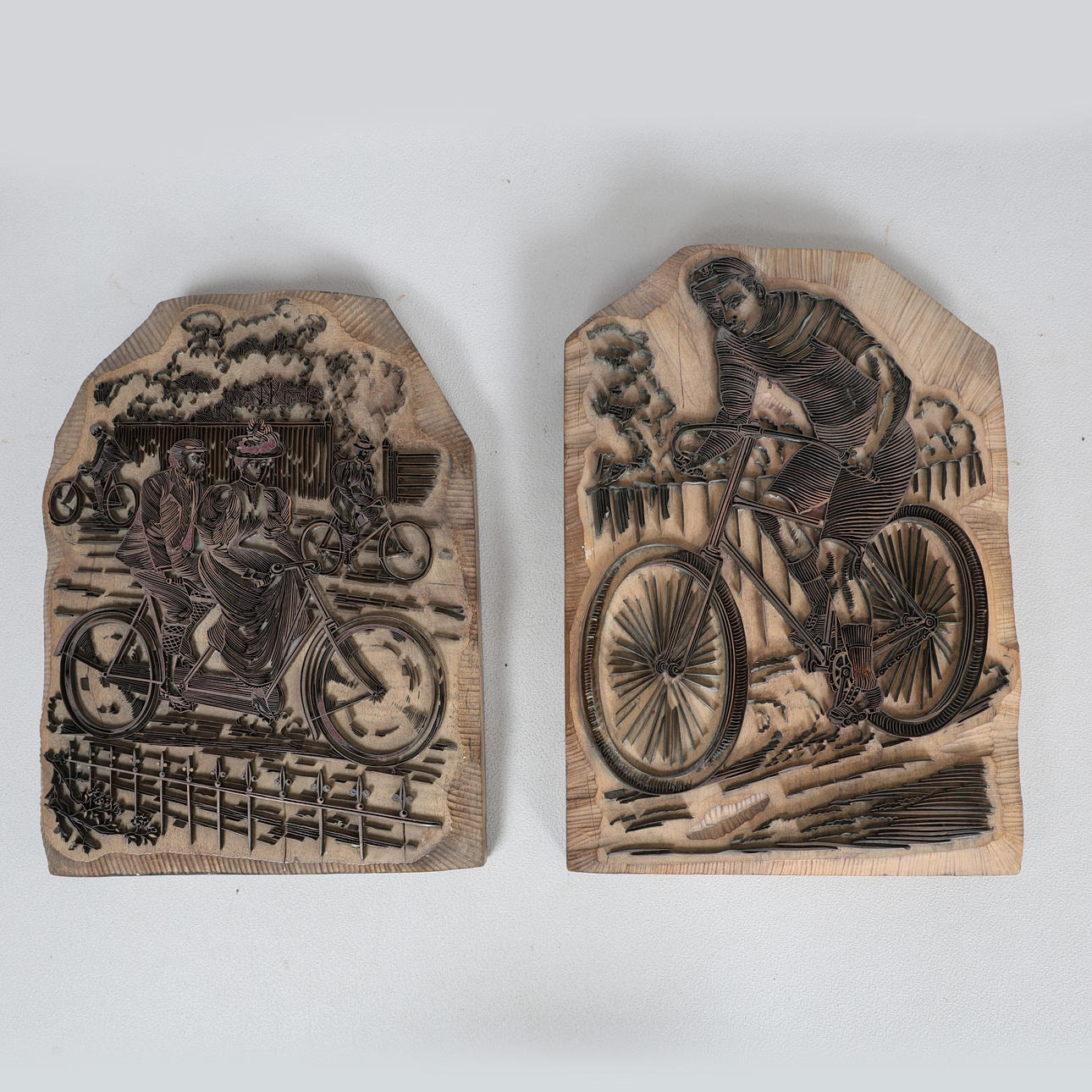A 20TH CENTURY PRINTING BLOCKS OF CYCLISTS (2).