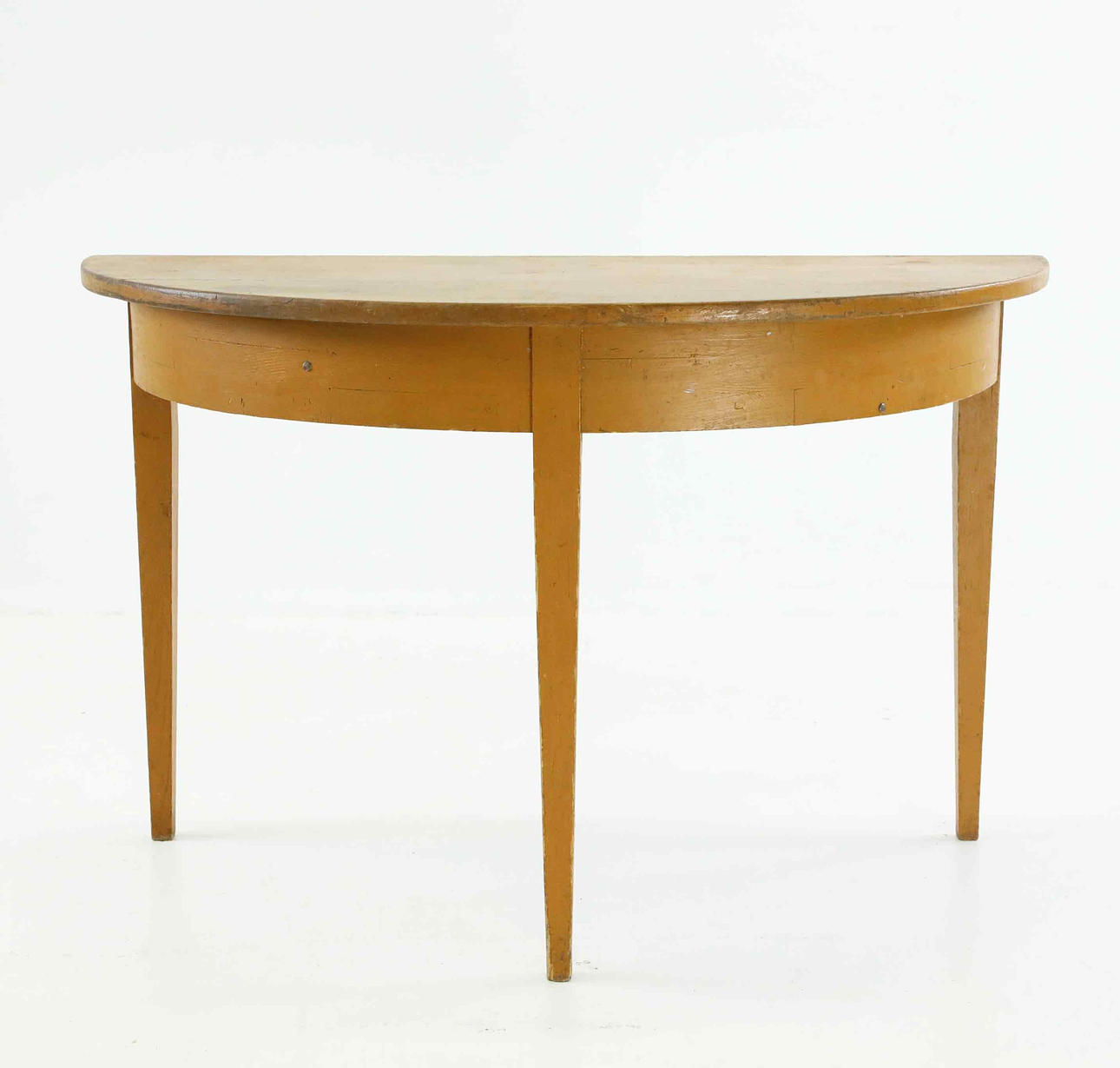 A half-moon table, early 20th century.