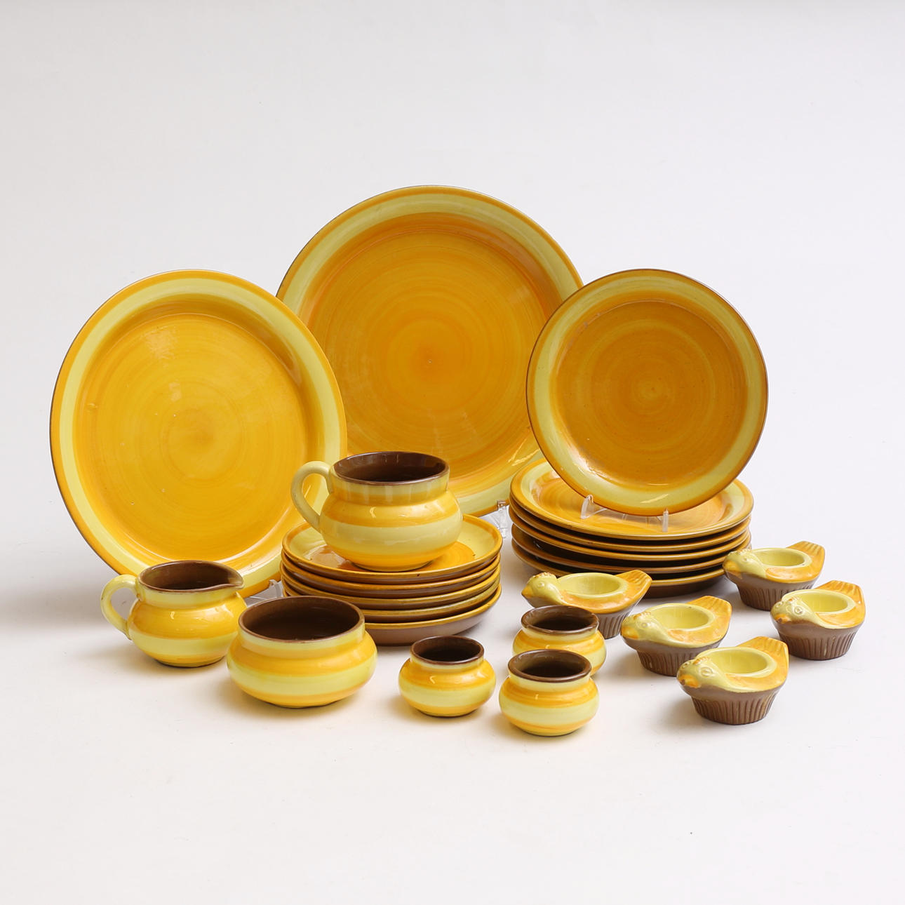 A set of 24 glazed ceramic tableware, Gabriel.