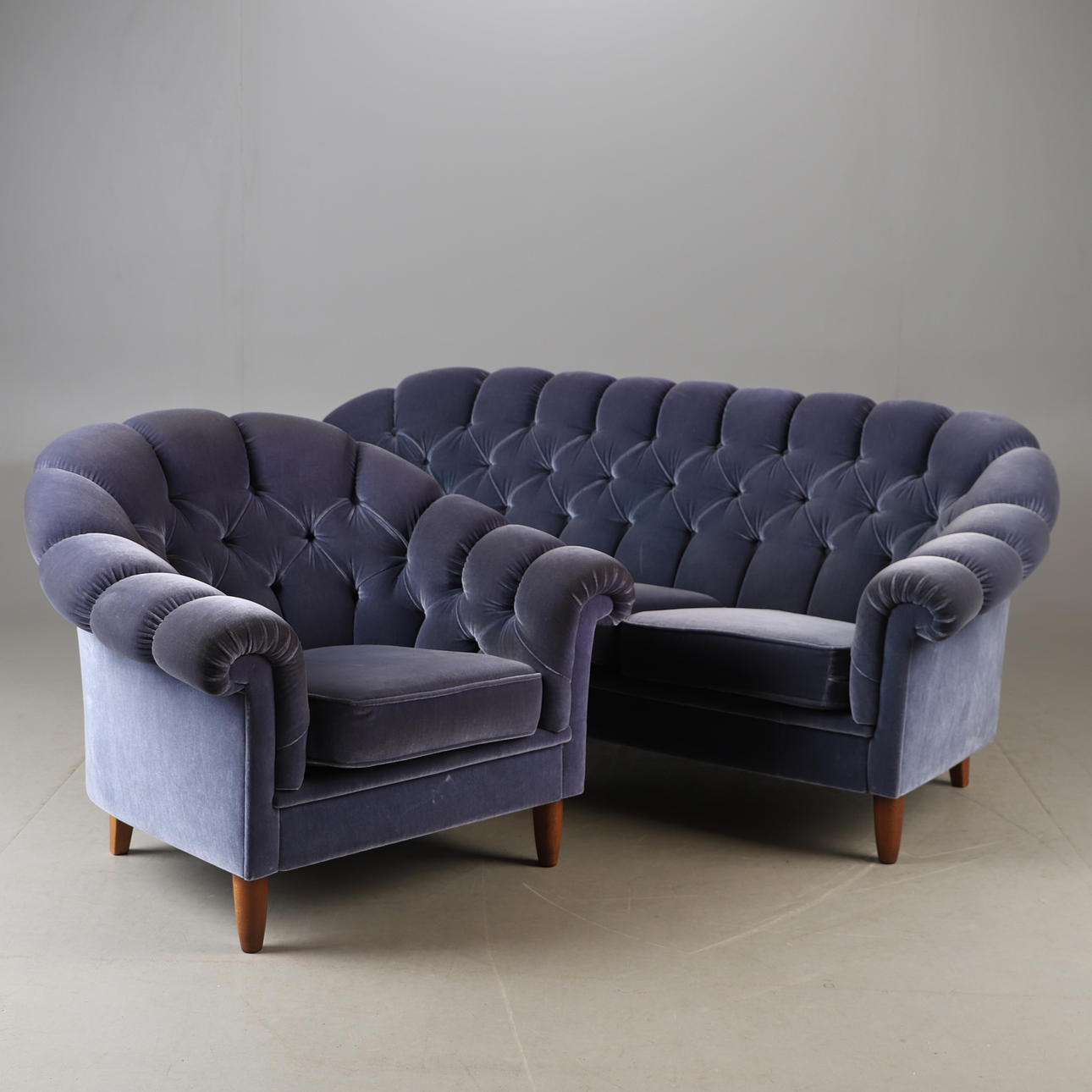 A mid 20th century plush sofa group.