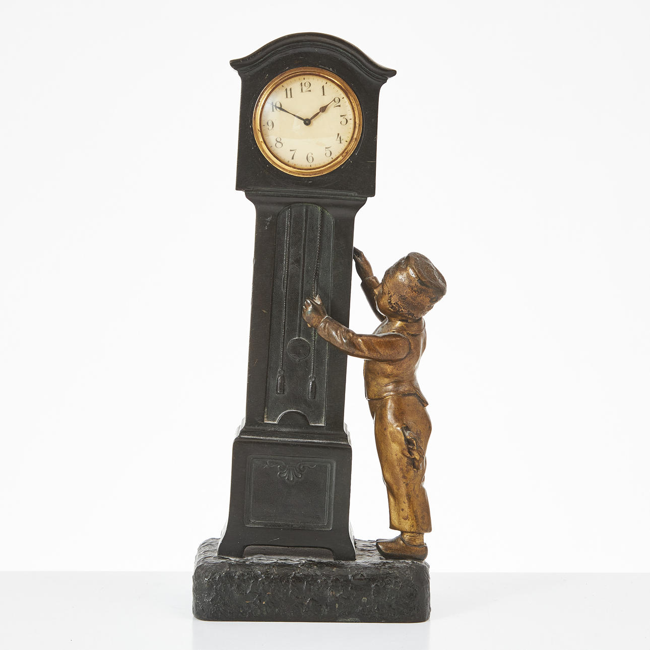 A table clock in the form of a floor clock with a boy, early 20th century, France, marked Fabrication Francaise, Paris.