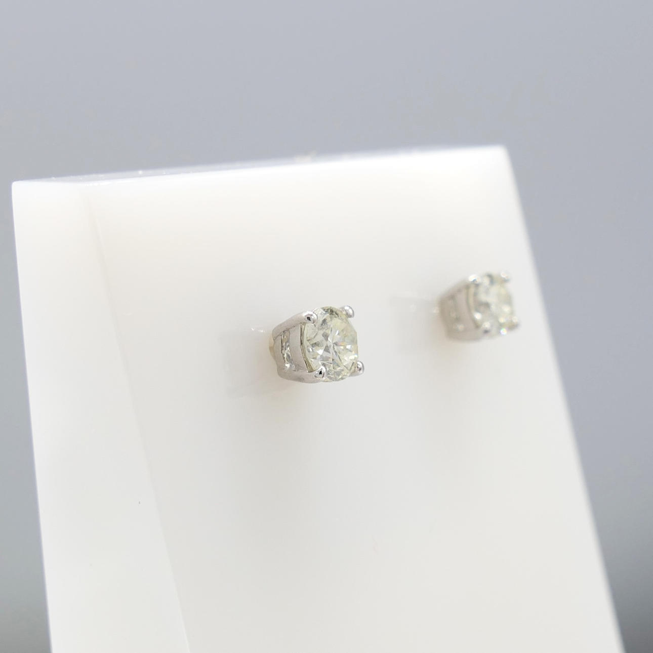 DIAMOND SOLITAIRE ear studs.