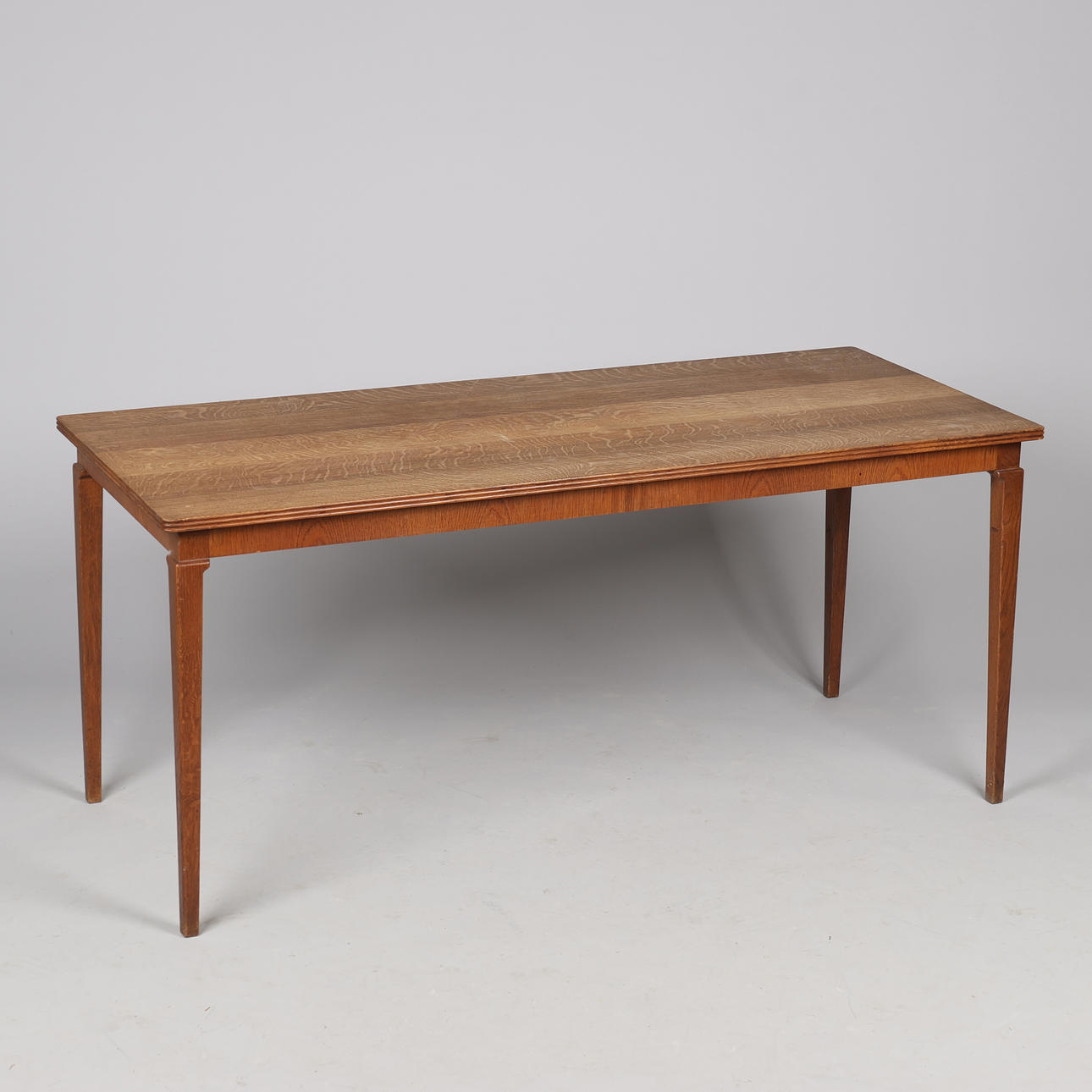FRITS HENNINGSEN (1889-1965). Attributed to. Rectangular oak coffee table with tapered legs, probably made by master carpenter Frits Henningesen, Denmark, circa 1940/50s.