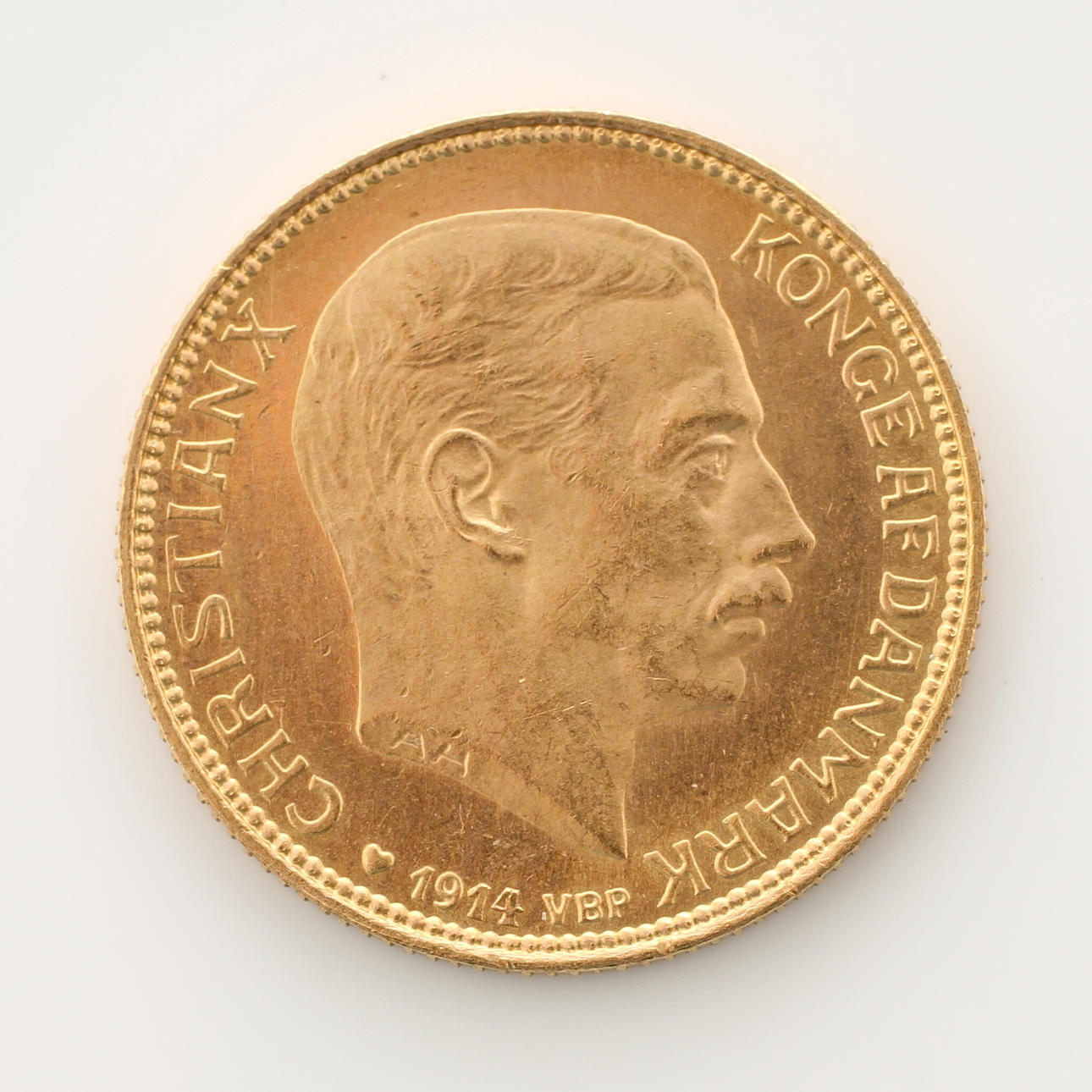 GULDMYNT, 21,6k guld, 20kr Christian X Danmark 1914.