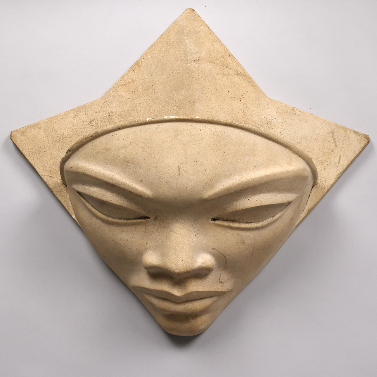 Wall hung artificial stone planter shaped as a face, dated 1946.