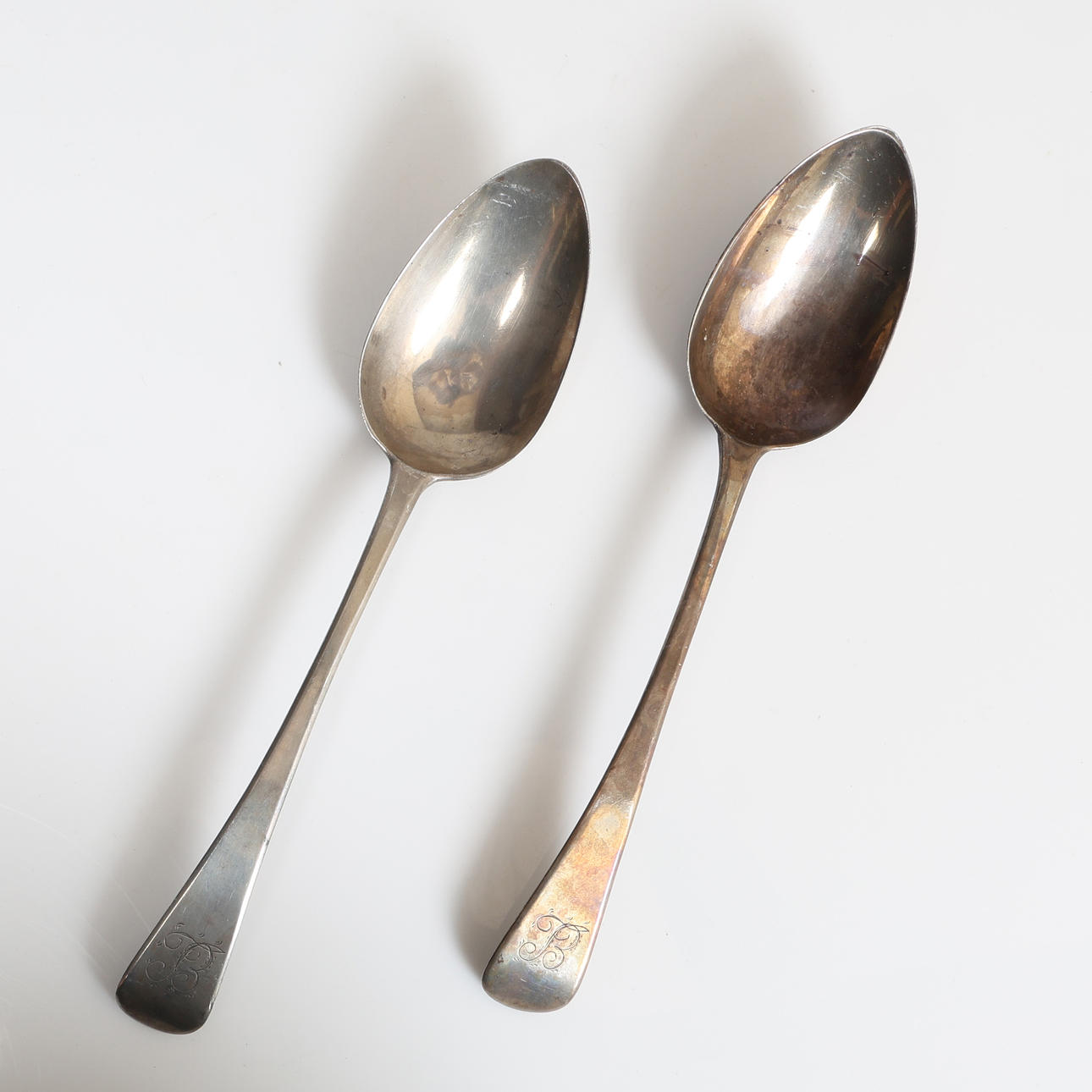 TWO GEORGE IV SILVER TABLE SPOONS (2).
