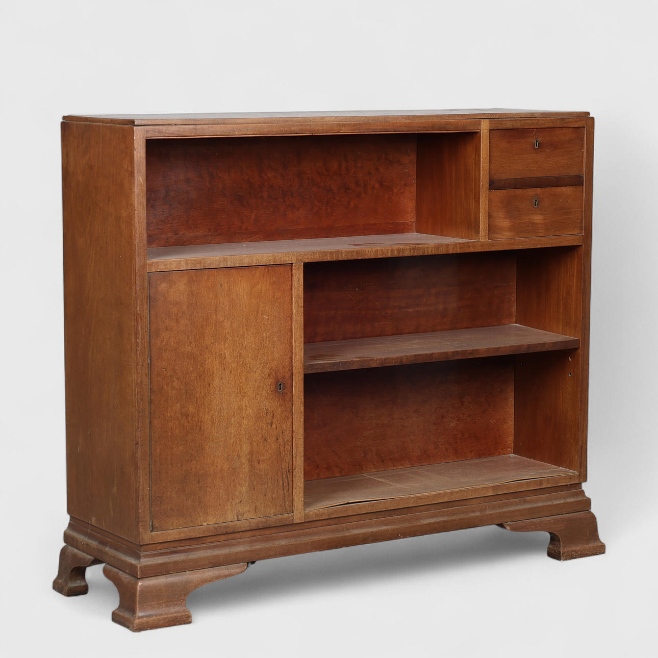 Bookcase of stained beech with two drawers and door, Danish cabinetmaker, first half of the 20th century.
