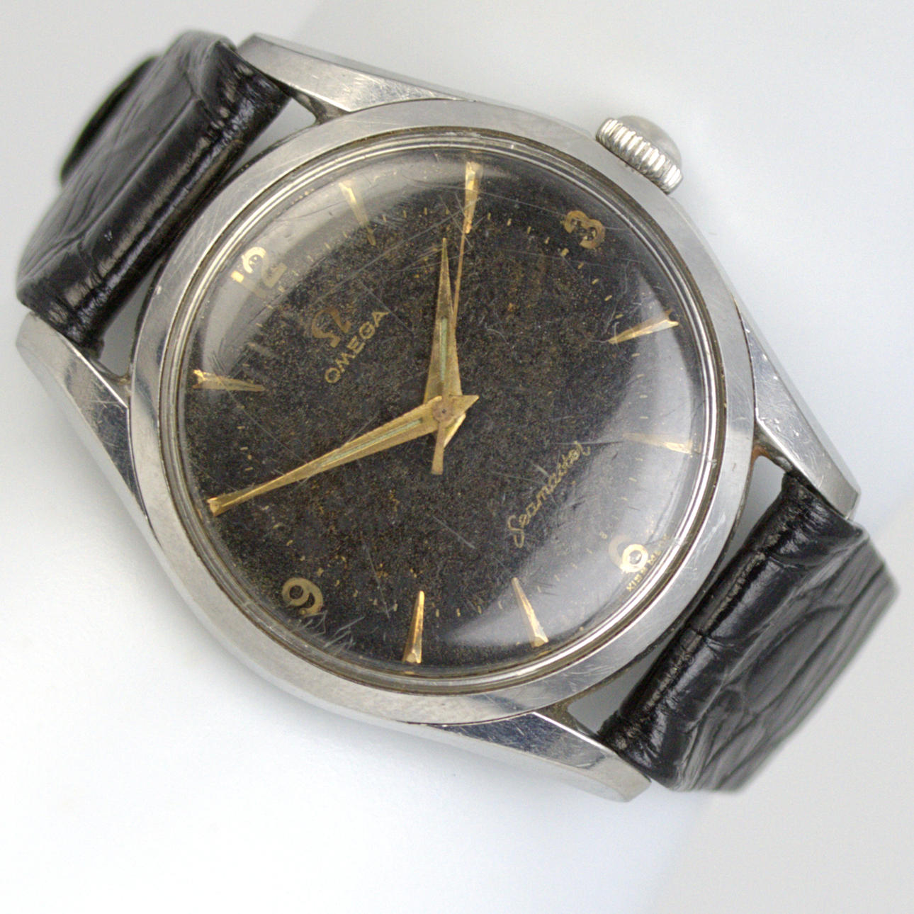 OMEGA. Seamaster, a men's manual wristwatch, black dial with bar index and Arabic numerals, leather bracelet, 1950-60's.