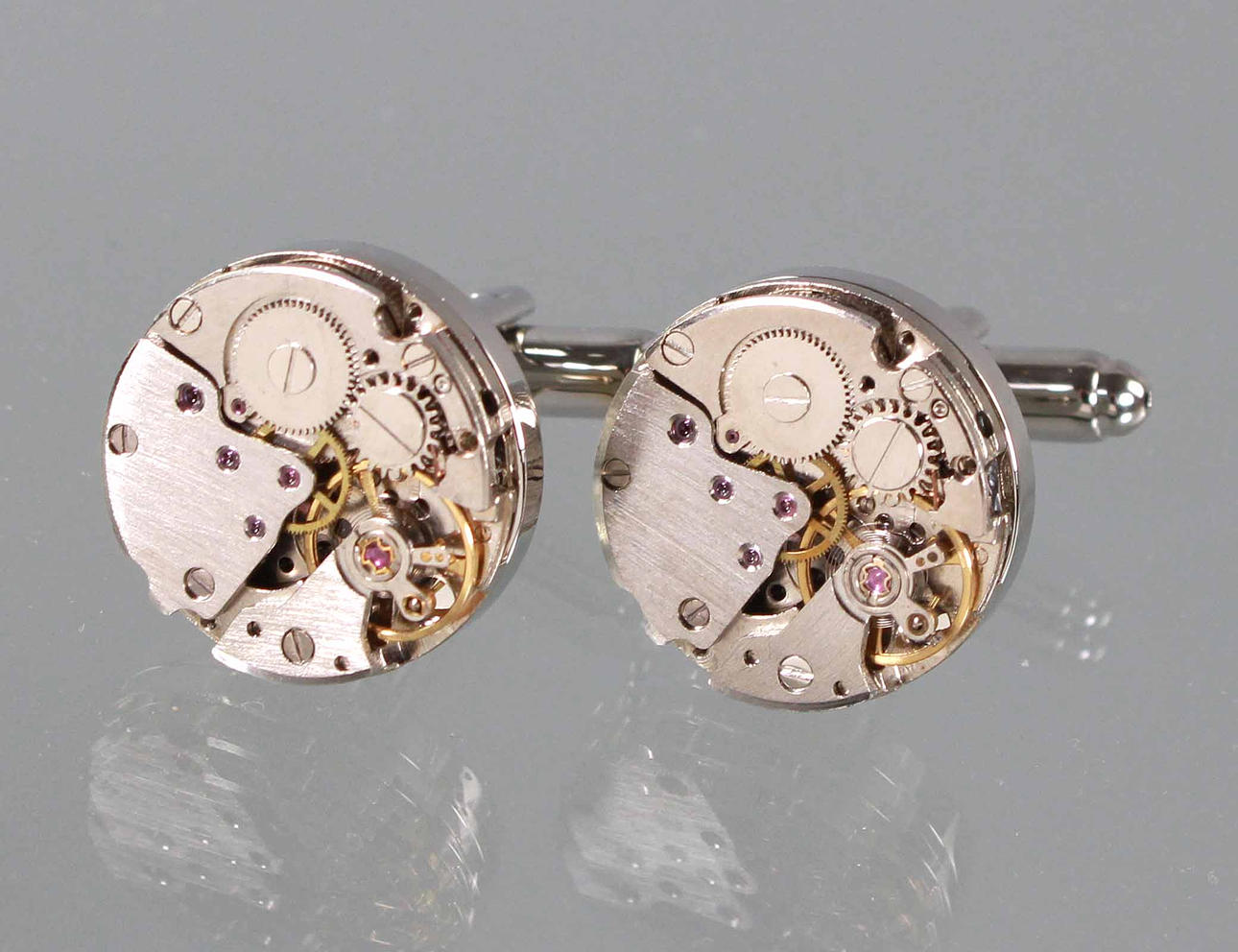 Cufflinks, clockwork shape.