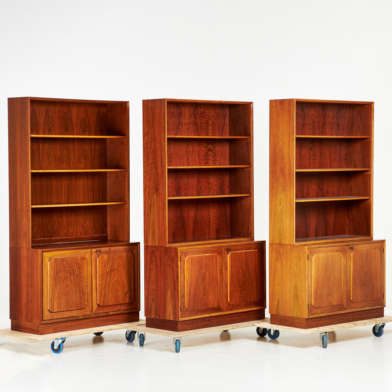 BOOKSHELVES. Three pieces, circa 1960s, veneered with walnut, AB Möbelfabriken Varia, Flen, two-piece.