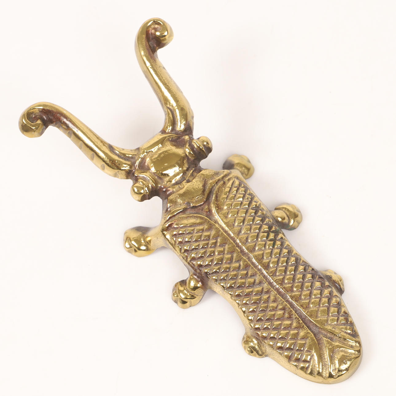 A boot jack, gilt cast iron, 20th century.