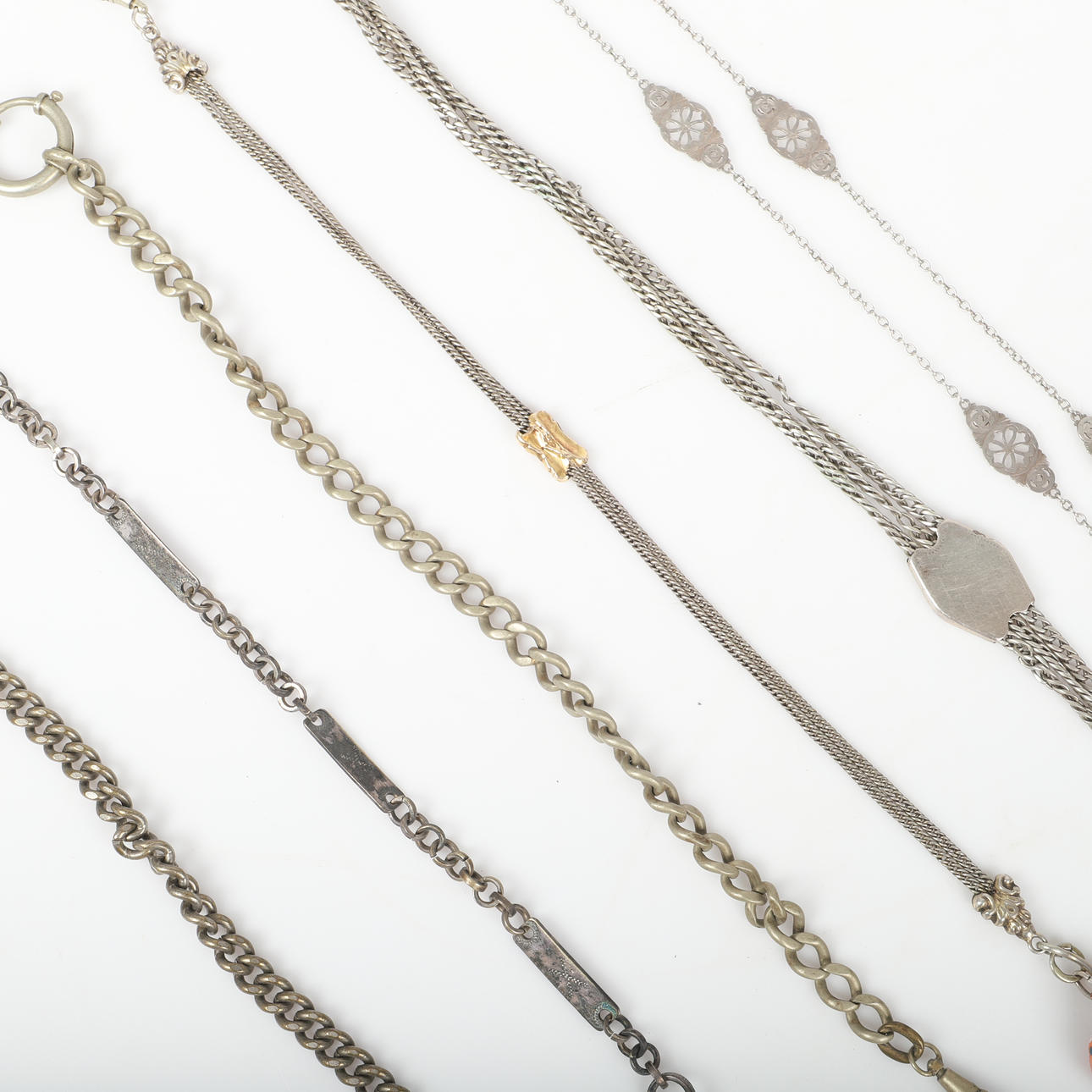 WATCH CHAINS AND CHATELAINE, 15 pieces, white metal.