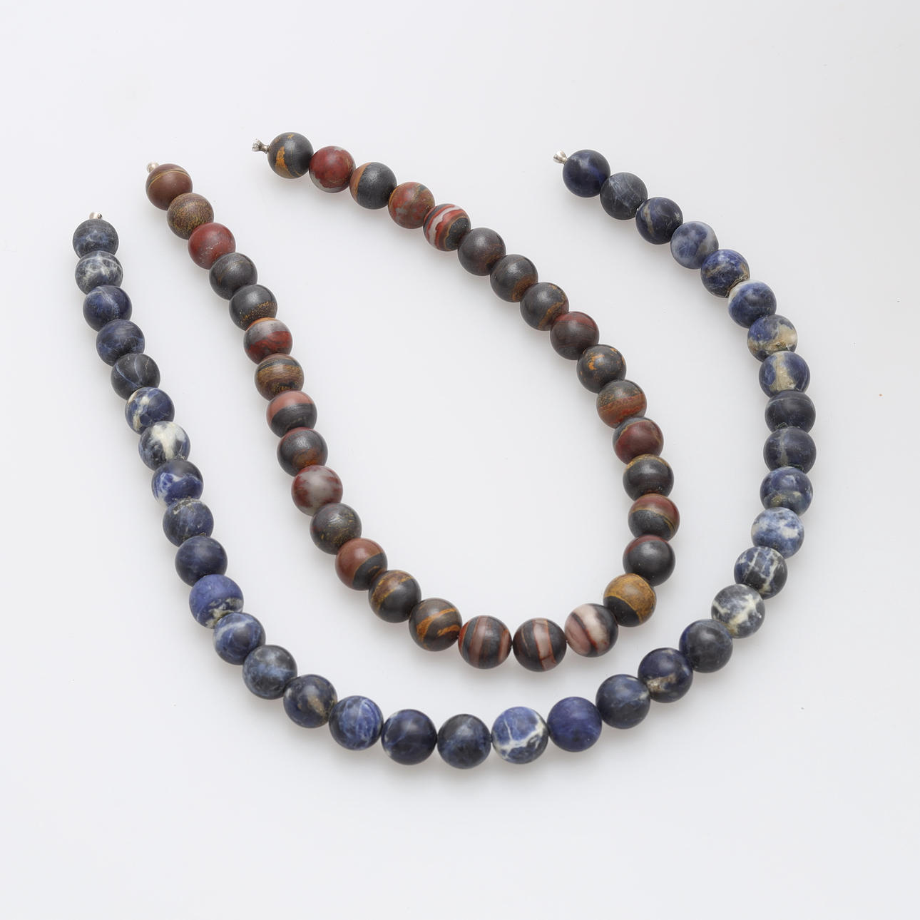 OLE LYNGGAARD. Stone necklace with studs, 2 pcs.