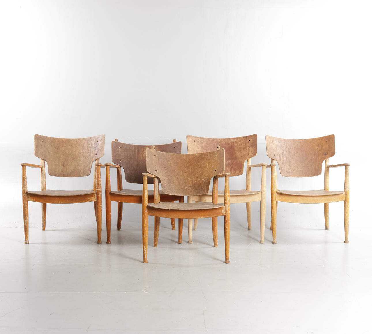 PETER HVIDT & ORLA MØLGAARD-NIELSEN. “Portex”, five armchairs with beech frame. Seat and back veneered with teak. Designed c. 1944. Performed 1940—1950s at Fritz Hansen. (5th).