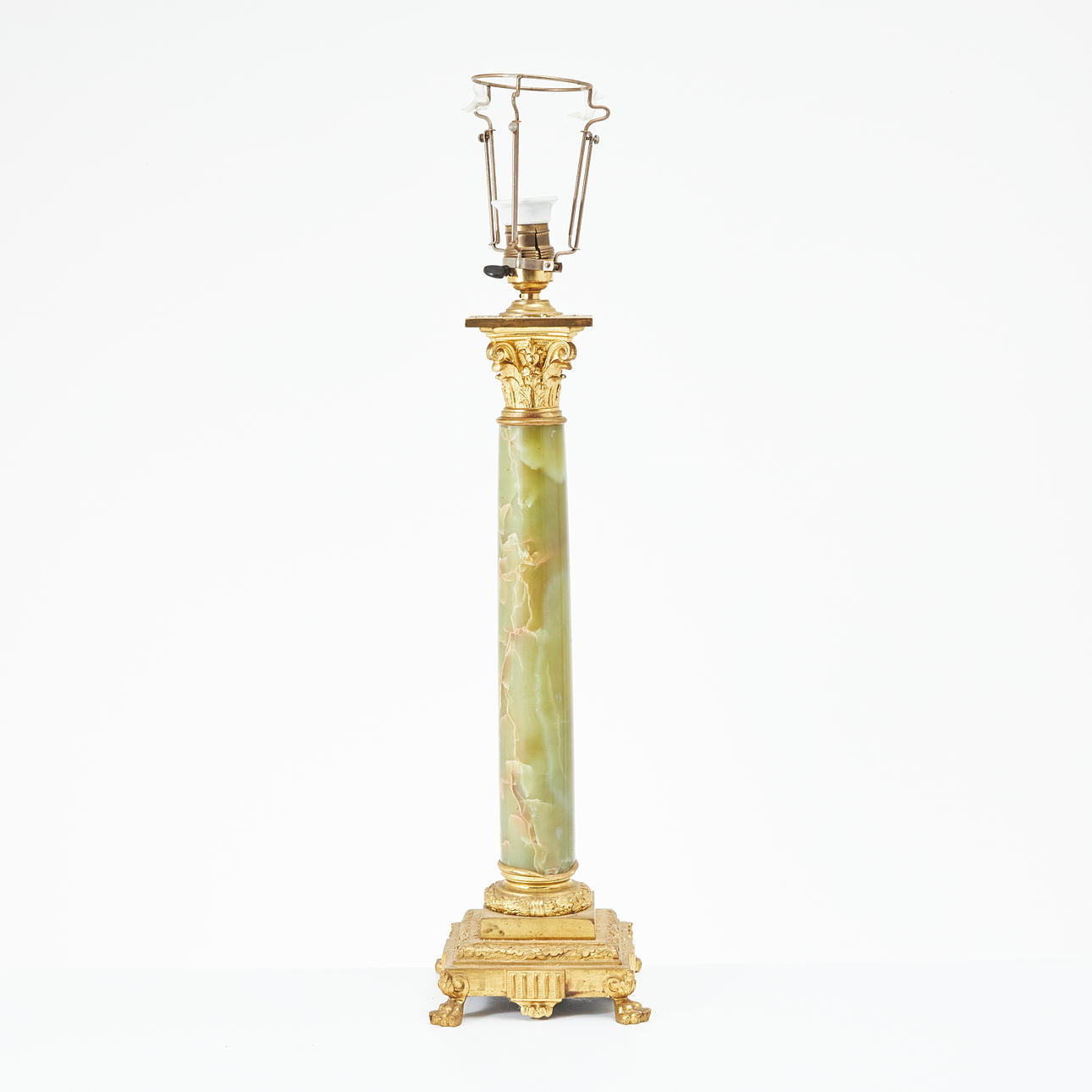 A table lamp, early 20th century, base of green onyx and brass in the shape of a Corinthian chapter.