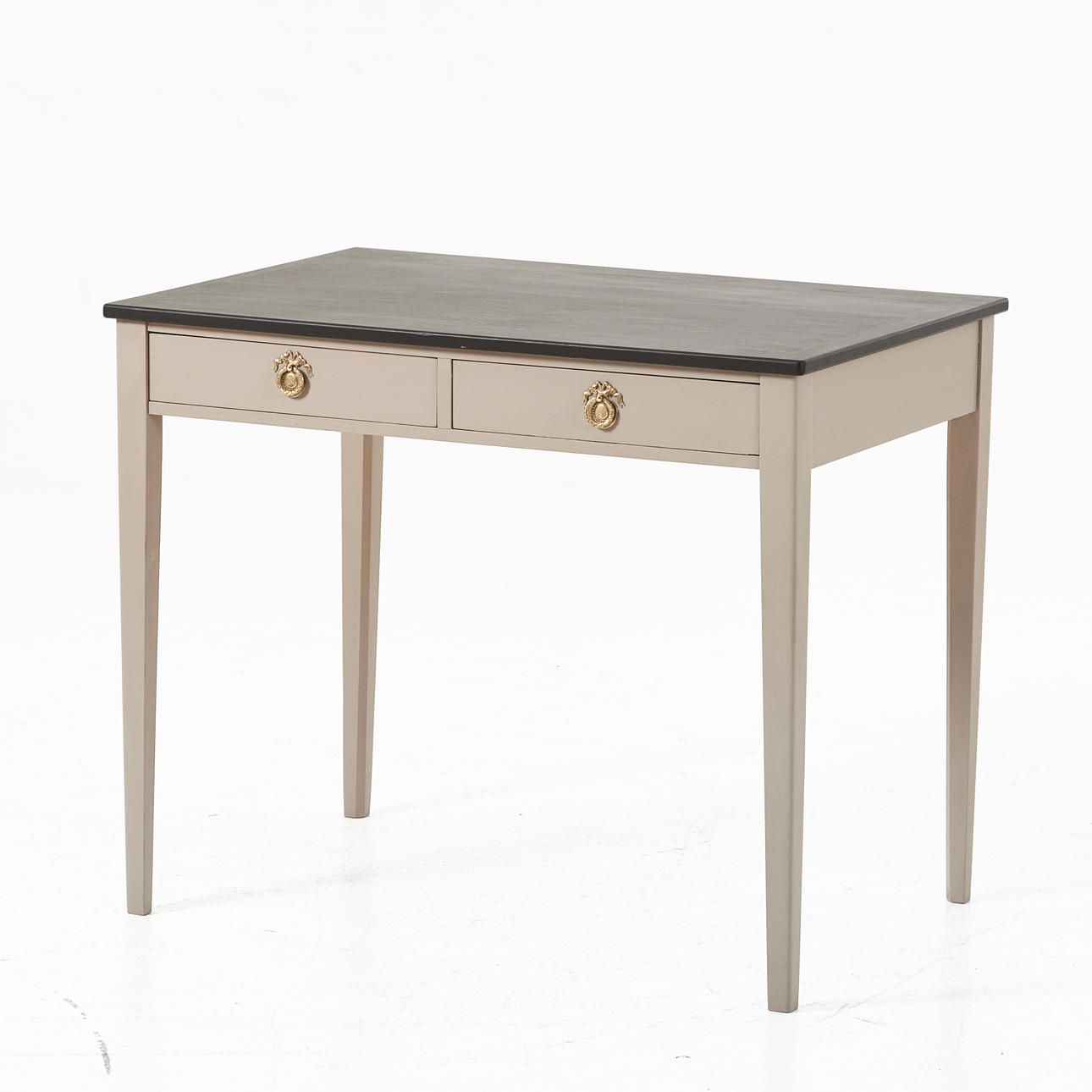 A Gustavian-style desk, later half of the 20th century, painted, two drawers in sargen with brass fittings.
